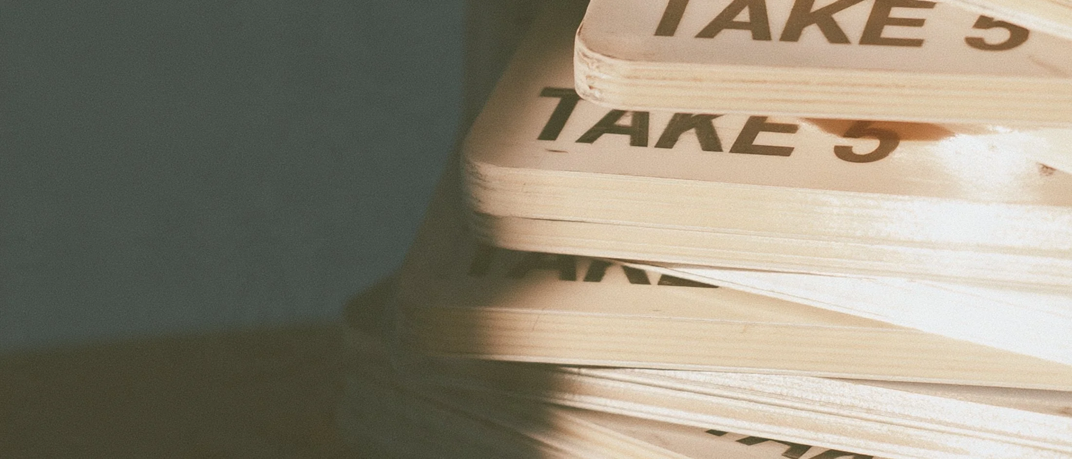 Stack of clapperboards marked take five, Big Little Content