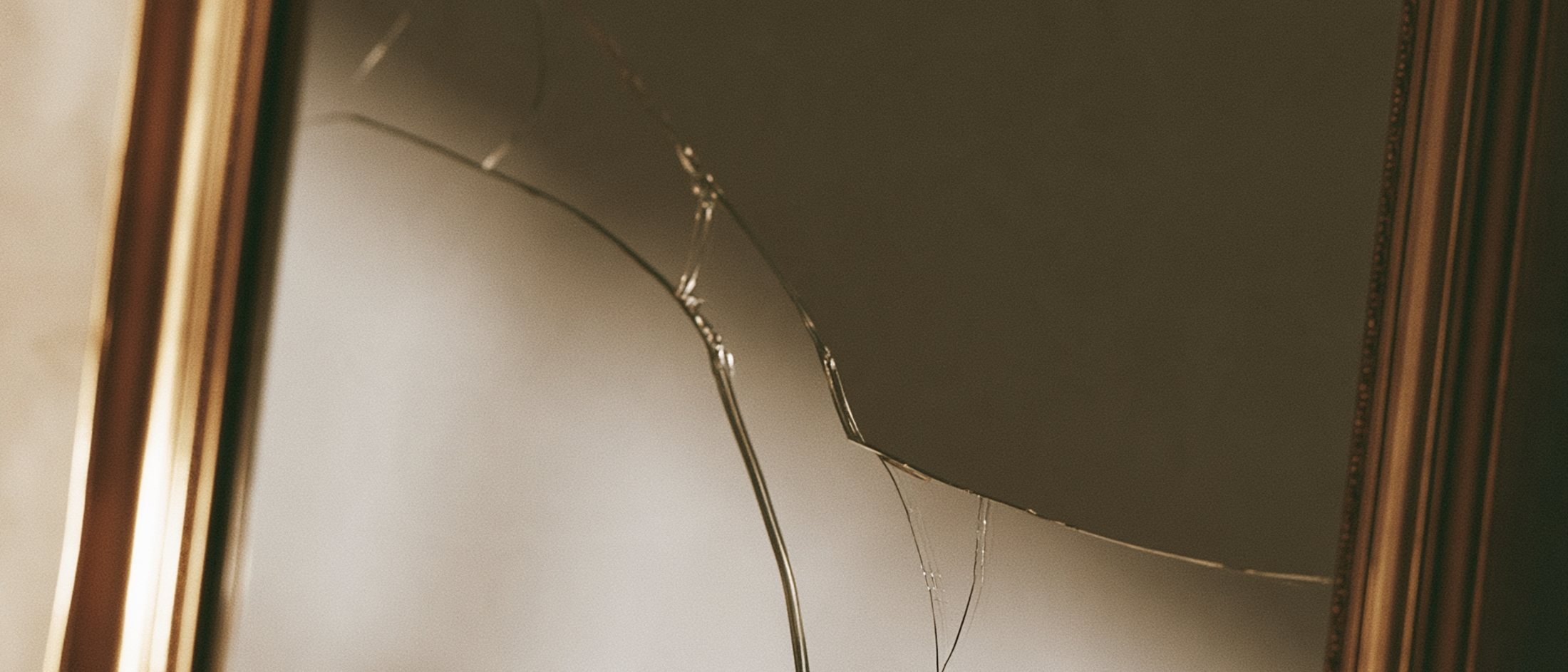 Cracked gold picture frame around an empty space, Big Little Content