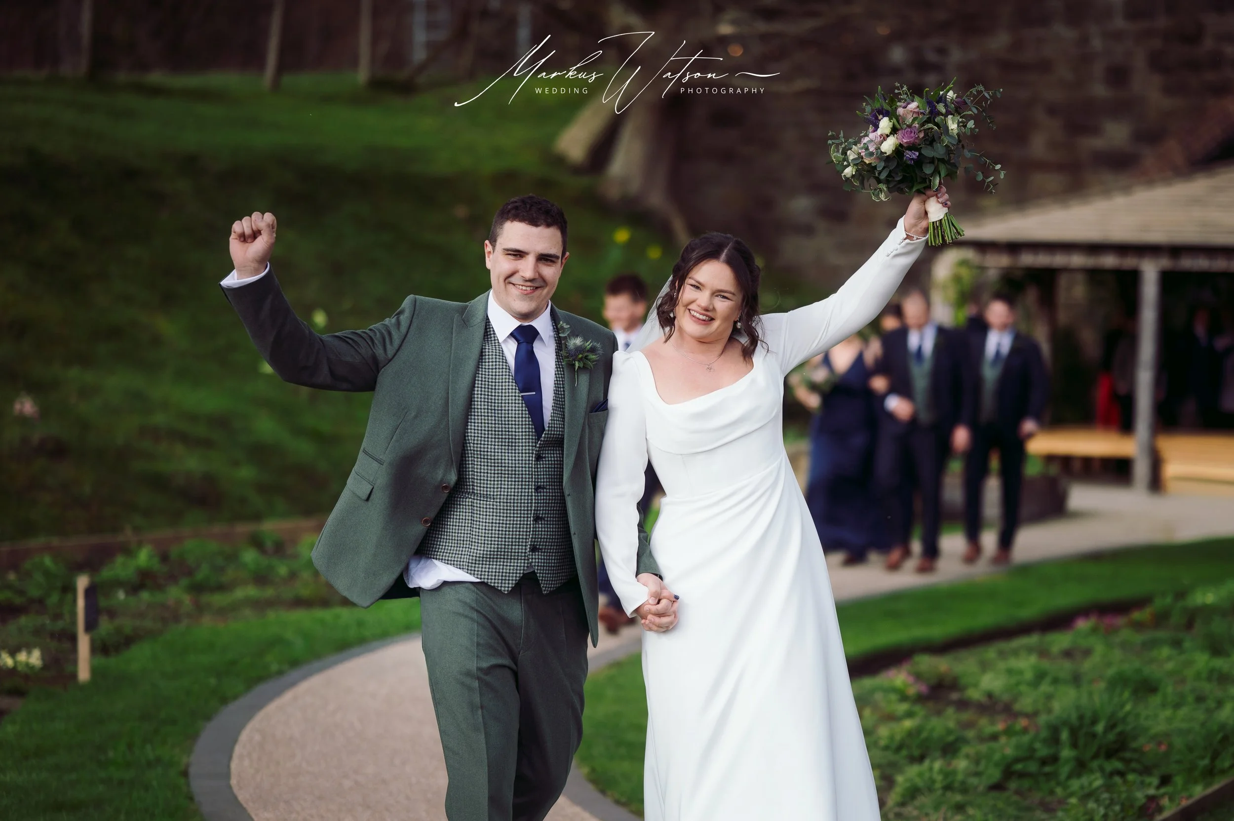 Bride and groom laughing together after ceremony at Tower Hill Barns in North Wales