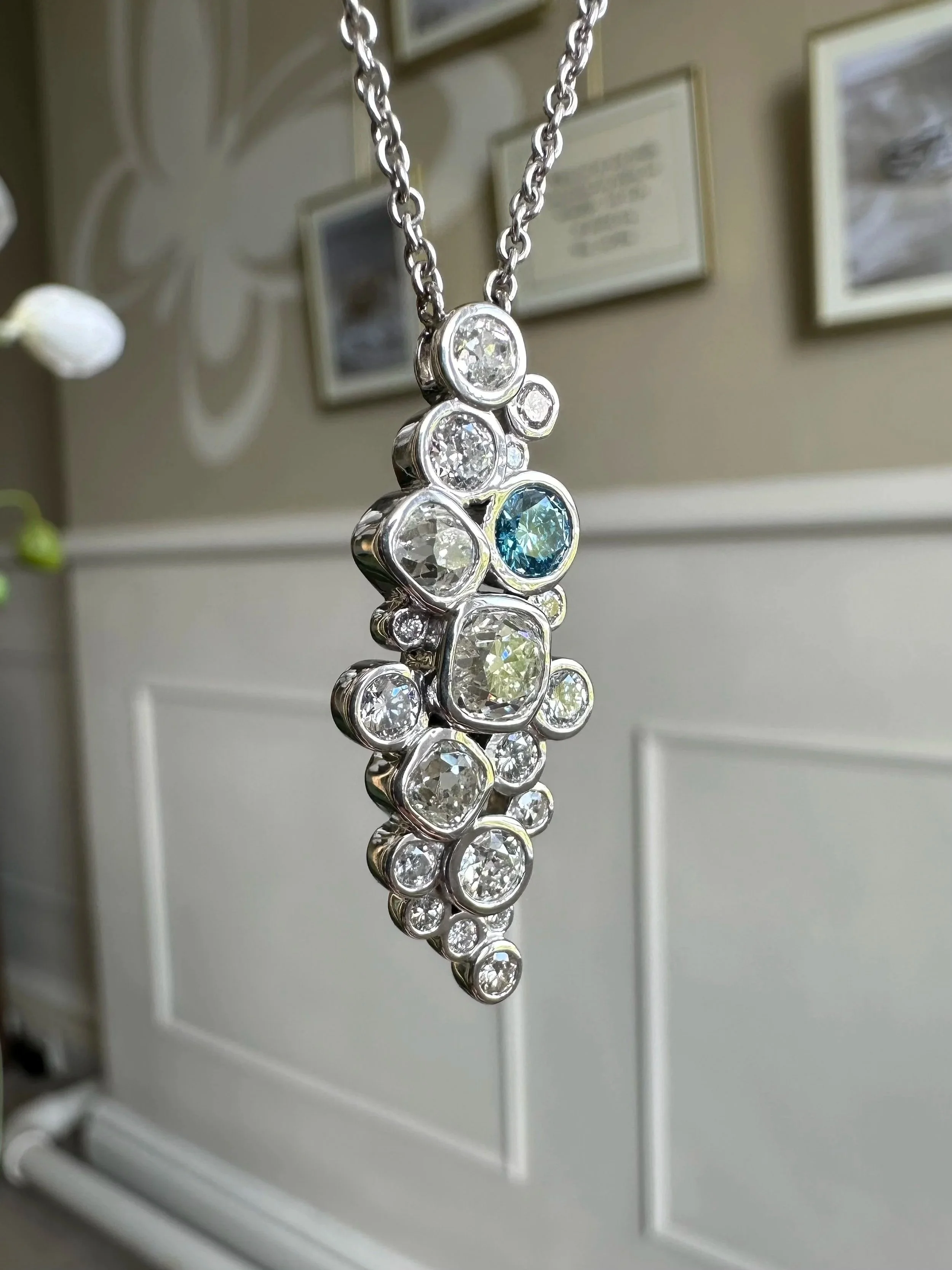 Completed platinum pendant featuring a blue diamond created from ashes