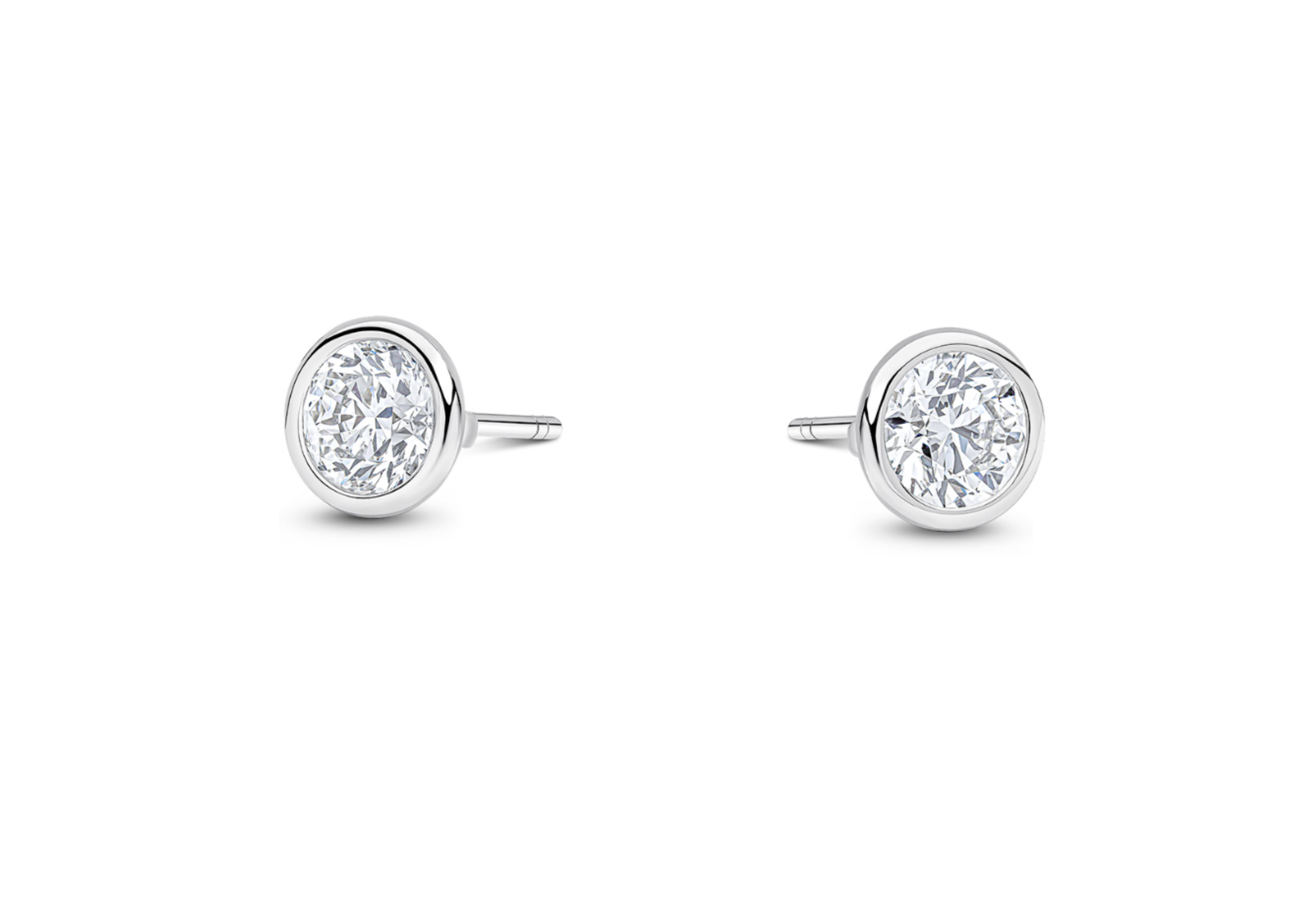 Pair of round diamond stud earrings with silver settings