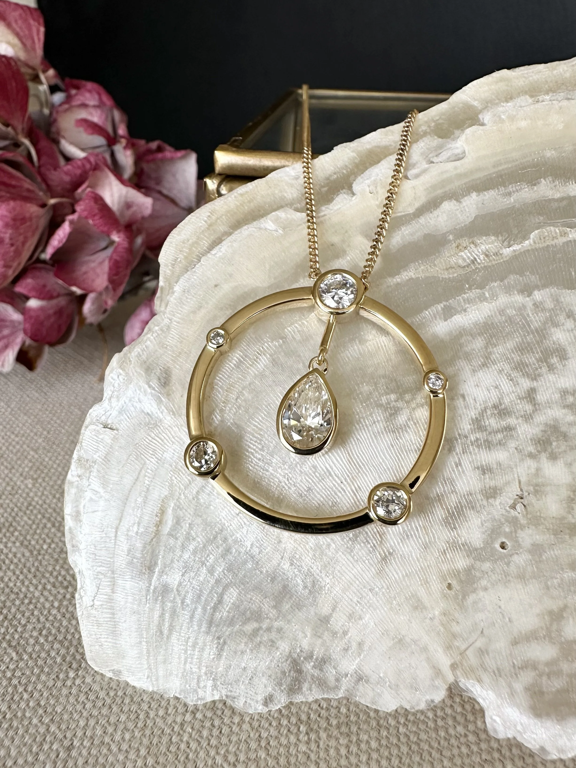 18ct gold diamond legacy pendant with pear-shaped diamond