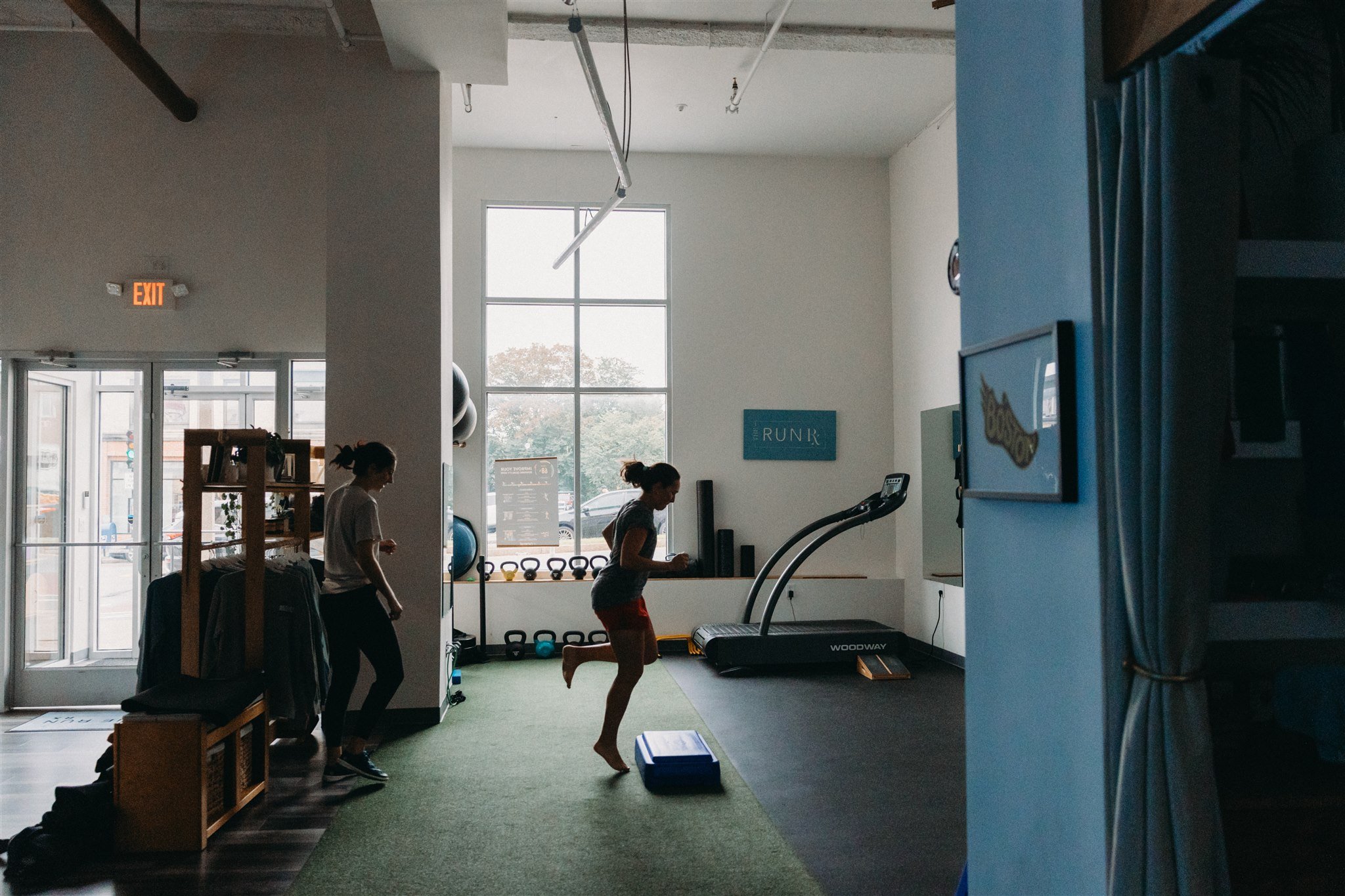 Runner performing plyometric bounding drill to improve running economy