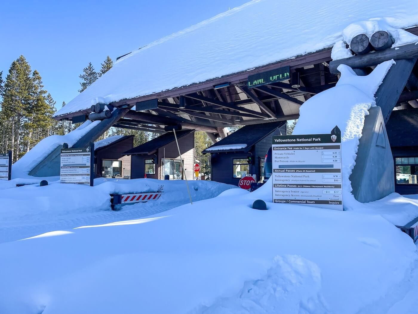 Yellowstone park entrance gates covered in snow