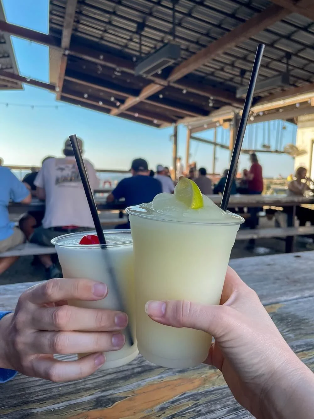 frozen marg and pina coloda on outdoor picnic table