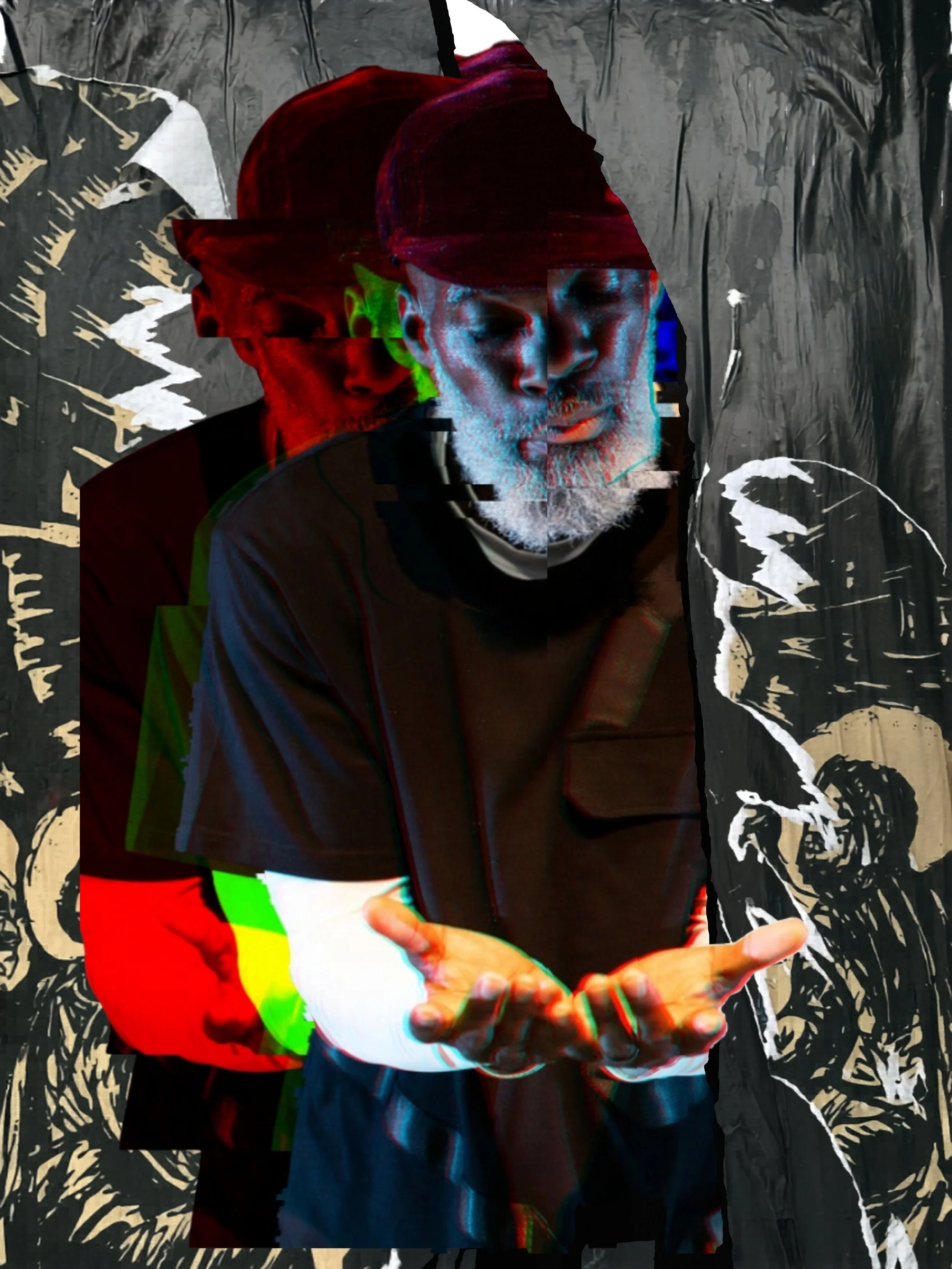 A man with a beard and glasses, wearing a hat, looking down at his hand, with a dark background featuring white floral designs.