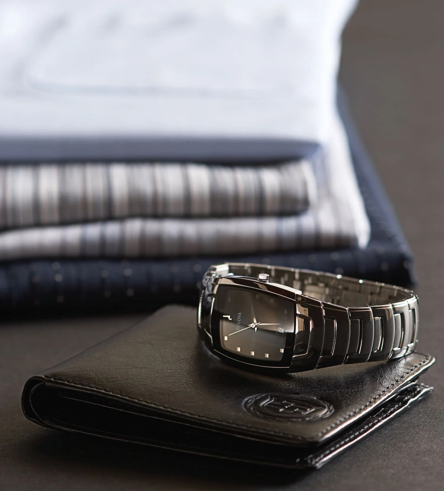 bulove watch on top of leather wallet cadillac lifestyle product photography toronto.jpg
