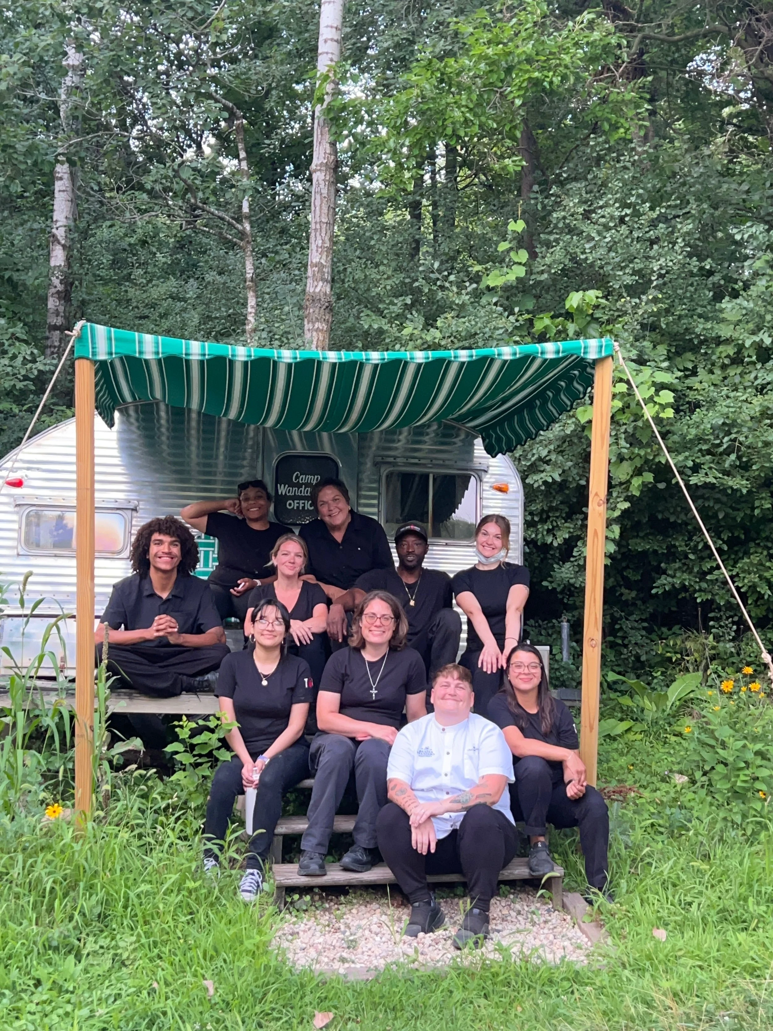 Brazen Standard Hospitality catering team posing at outdoor event location in Wisconsin