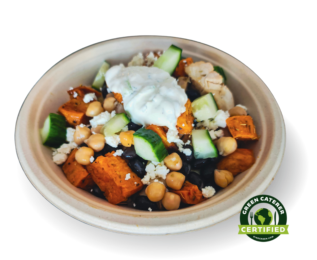 A bowl of a plant-based salad with chickpeas, cucumber pieces, roasted sweet potatoes, black beans, and topped with plant-based cheese and a dollop of plant-based sour cream. Green Caterer Certified logo in the bottom right corner.