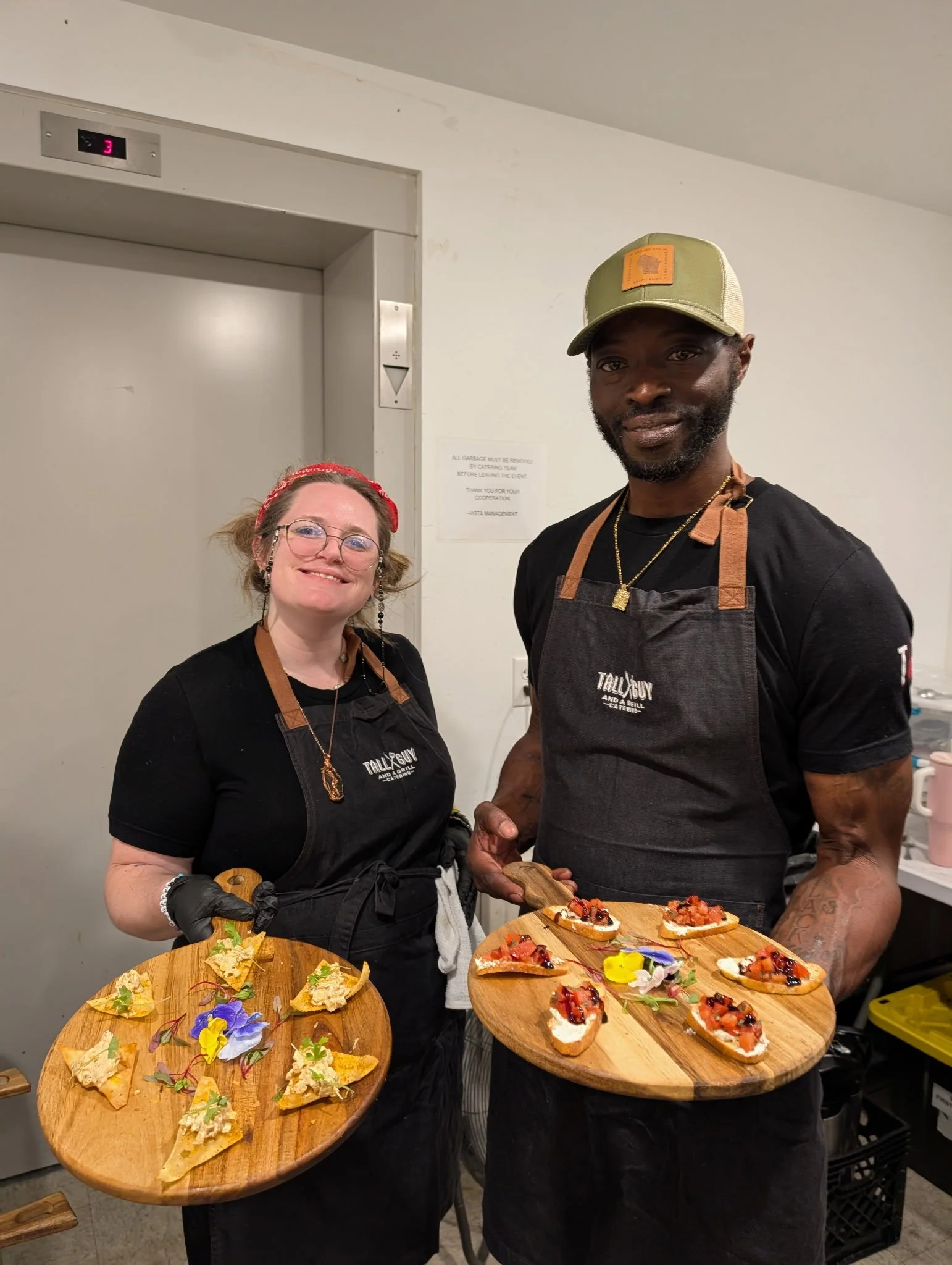 Tall Guy and a Grill Catering kitchen staff preparing to serve  passed appetizers at Milwaukee event
