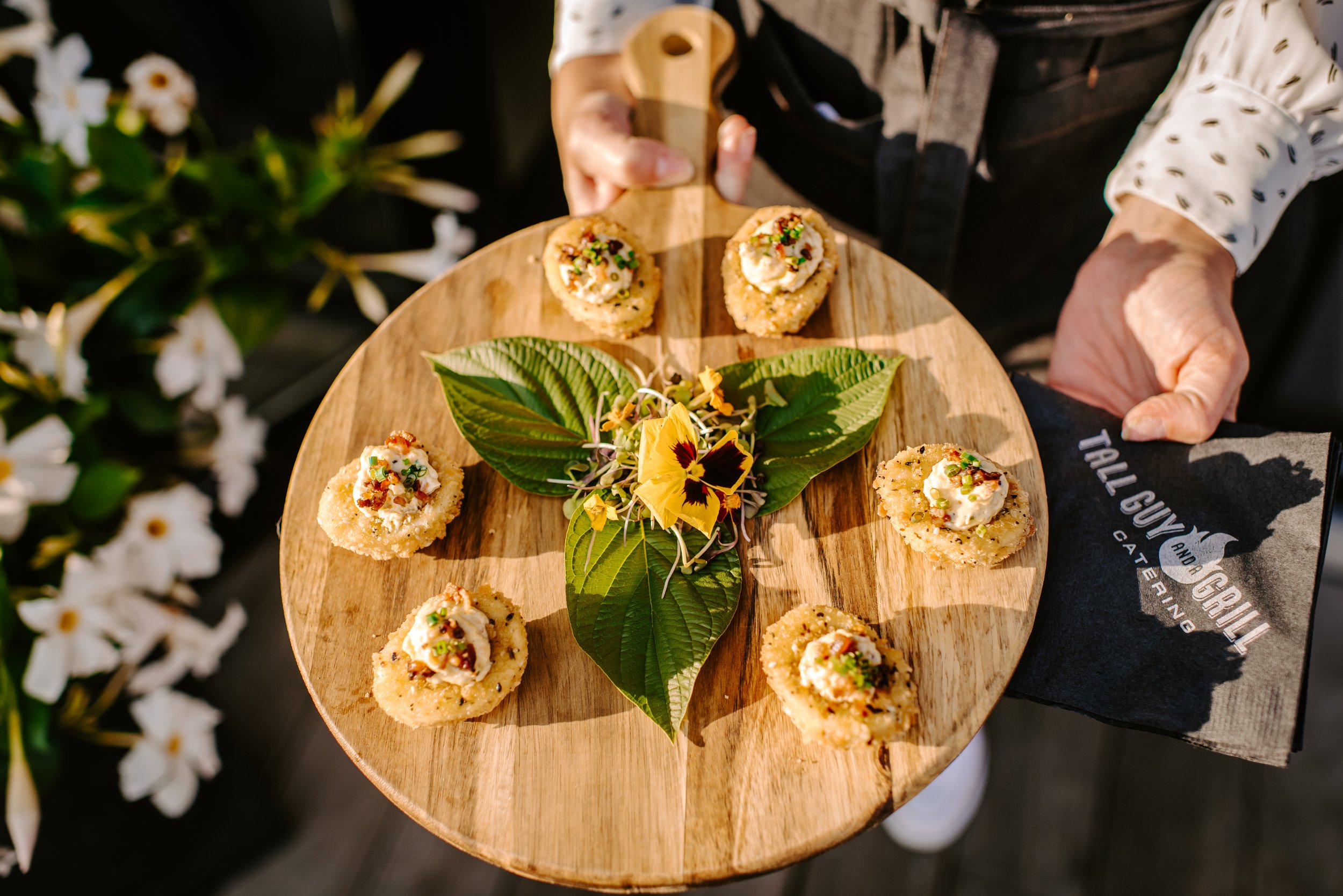 Beautifully presented passed appetizers from Tall Guy and a Grill Catering, part of Brazen Standard Hospitality serving events across Milwaukee and Southeastern Wisconsin.