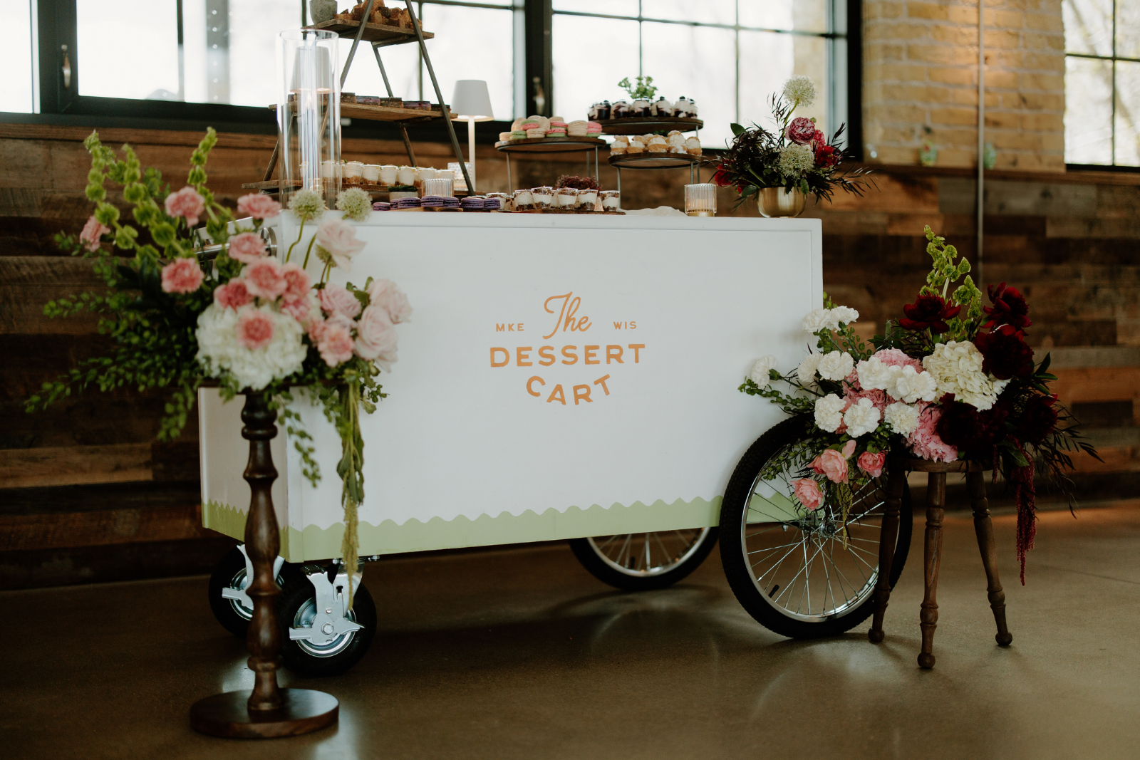 Elegant mobile dessert cart catering display by The Dessert Cart serving ice cream, frozen custard, and mini desserts for weddings and events in Milwaukee.