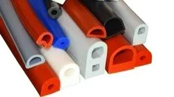 Various colored rubber profiles for sealing or insulation, including red, blue, black, grey, and white, in different shapes and sizes.
