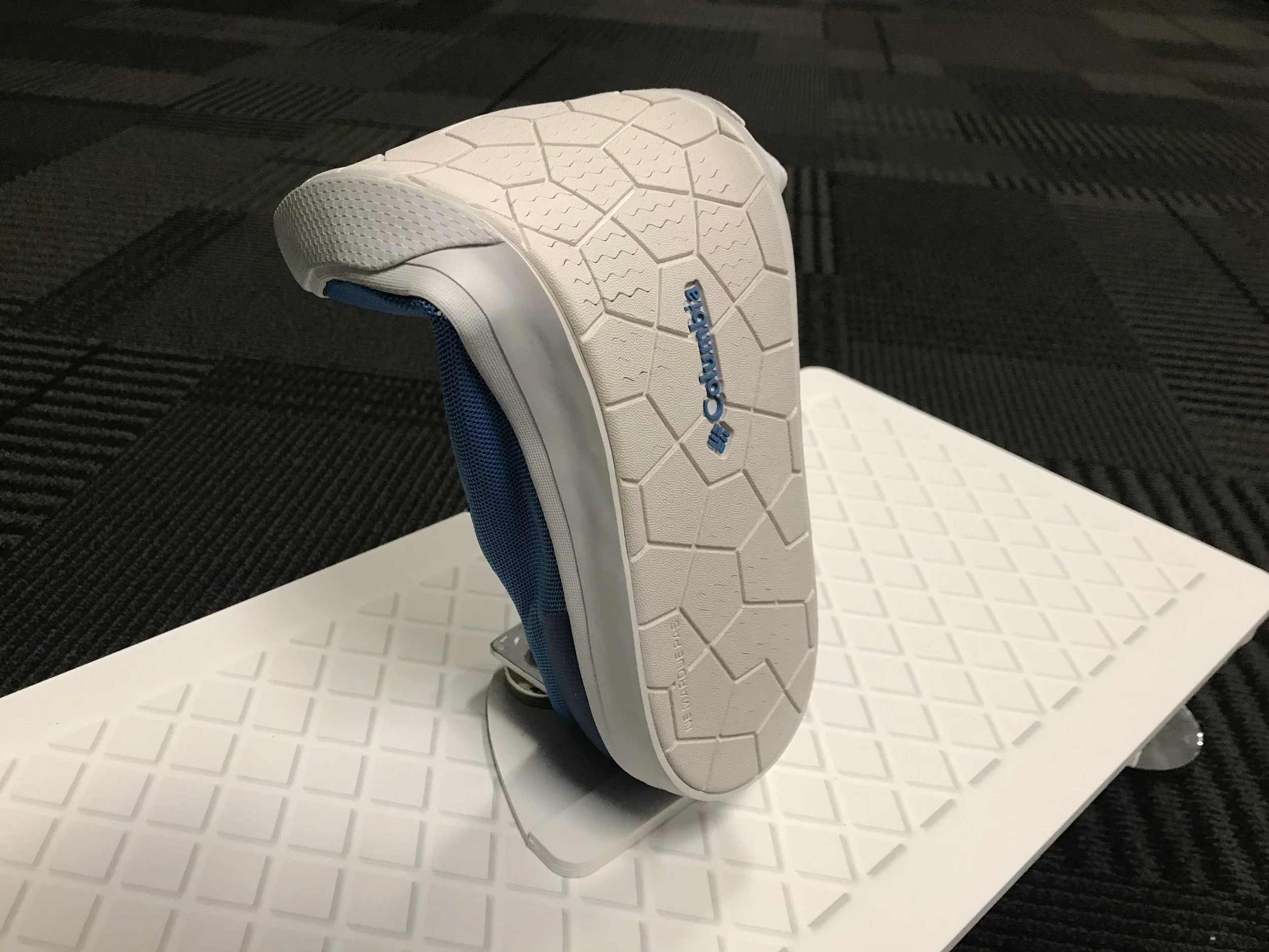 Custom Fixture Showcasing Shoe Features