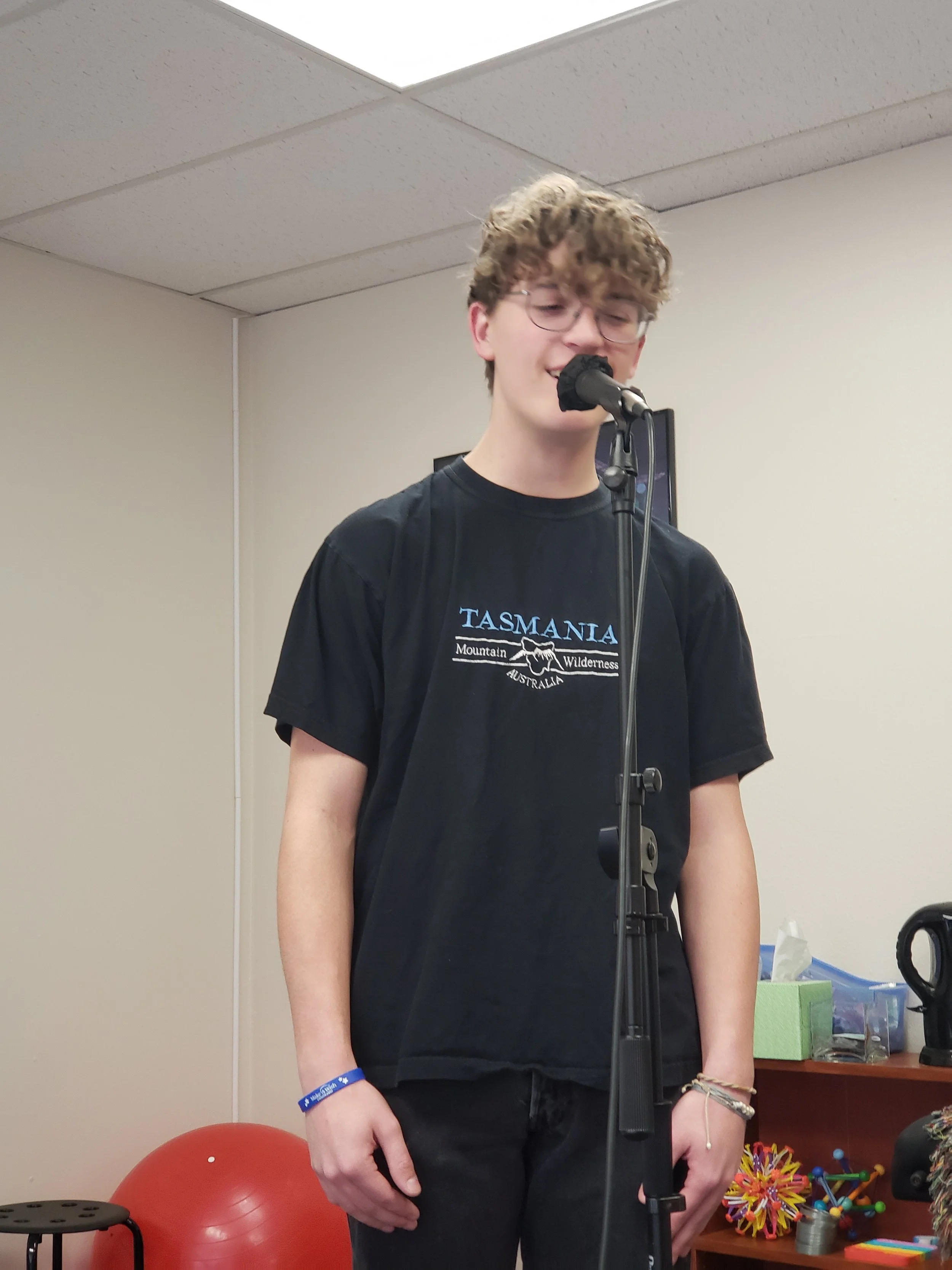 Singer practicing microphone skills.