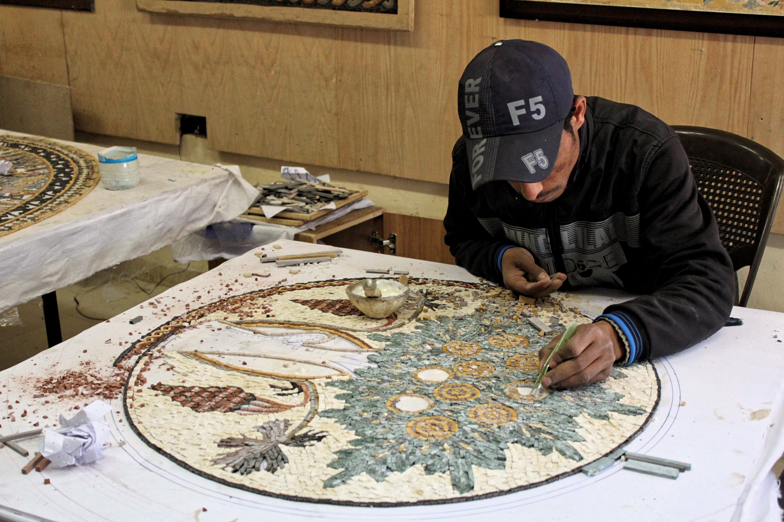 A man working at a mosaic shop in Madaba, Jordan