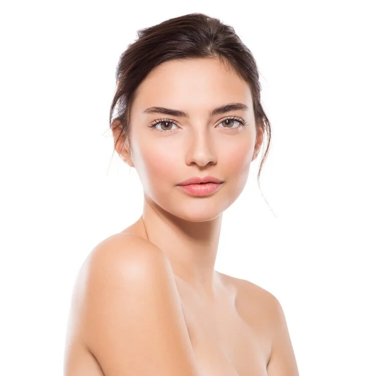 Portrait of woman with natural makeup and bare shoulders on white background.