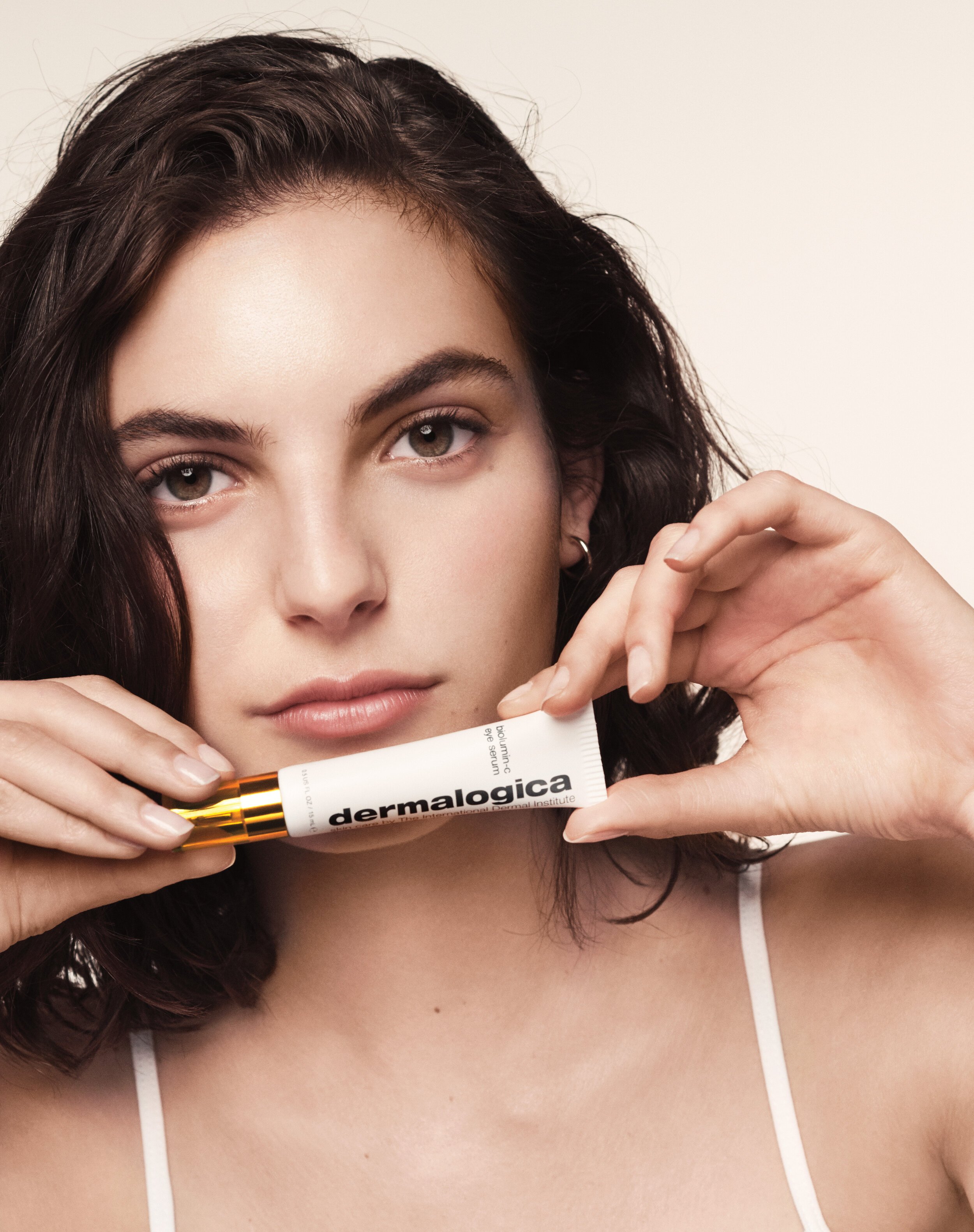 LAUNCH+-+Model+Female+1+Holding+Product+Tube-+Biolumin-C+Eye+Serum.jpg