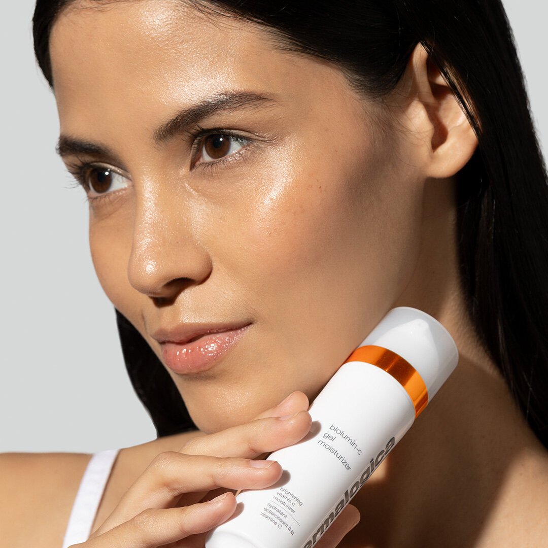 1x1+-+Nancy+with+bottle+-+Biolumin-C+Gel+Moisturizer+%281%29.jpg