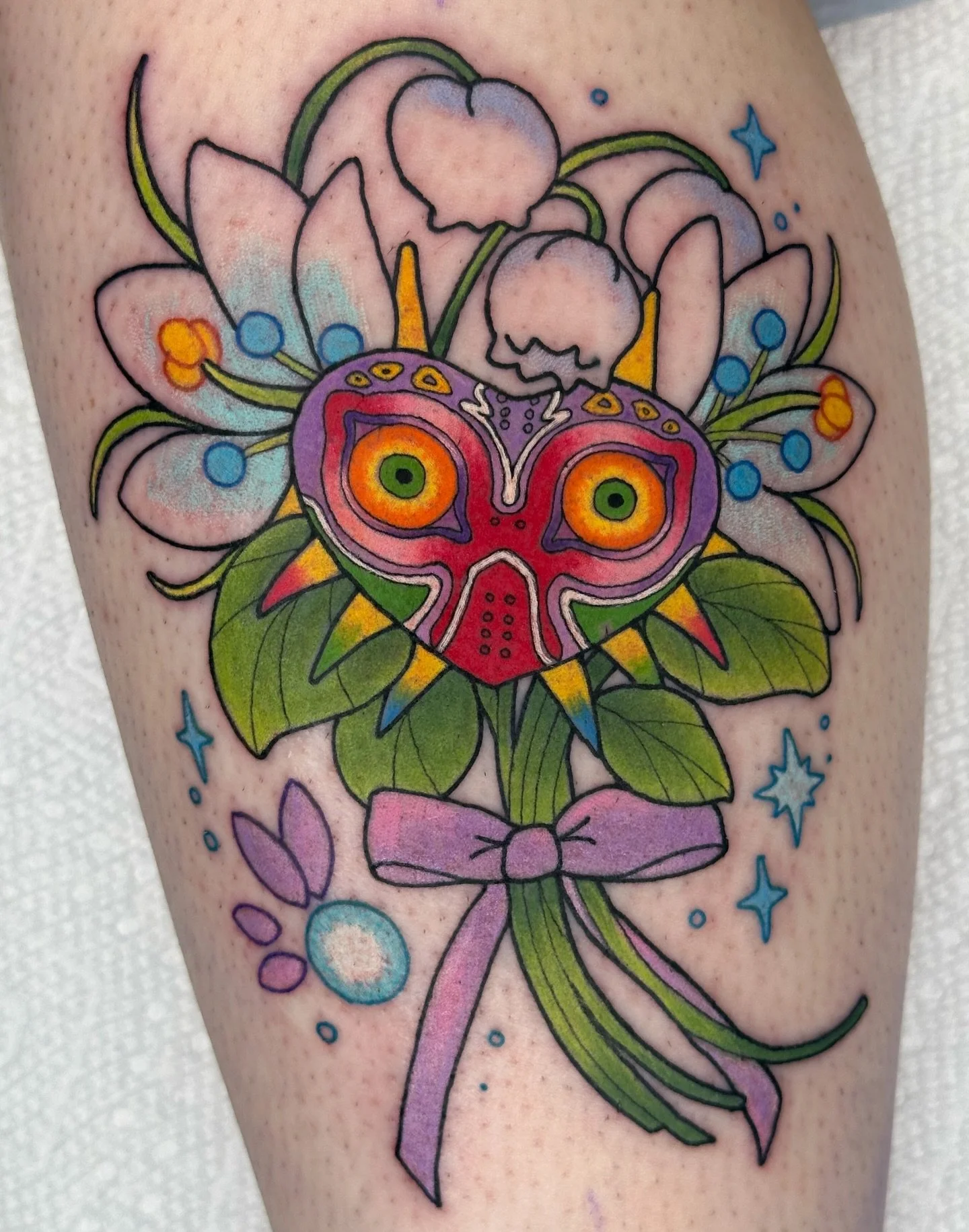 Majoras Mask bouquet tattoo! From my predrawns see more available to be claimed @bons.lagoon 
.
Booking Dec-Feb booking link in bio 📍 Los Angeles/OC 
.
#losangelestattoo #losangelestattooartist #latattooartist #latattoo #octattoo #bayareatattoo #las
