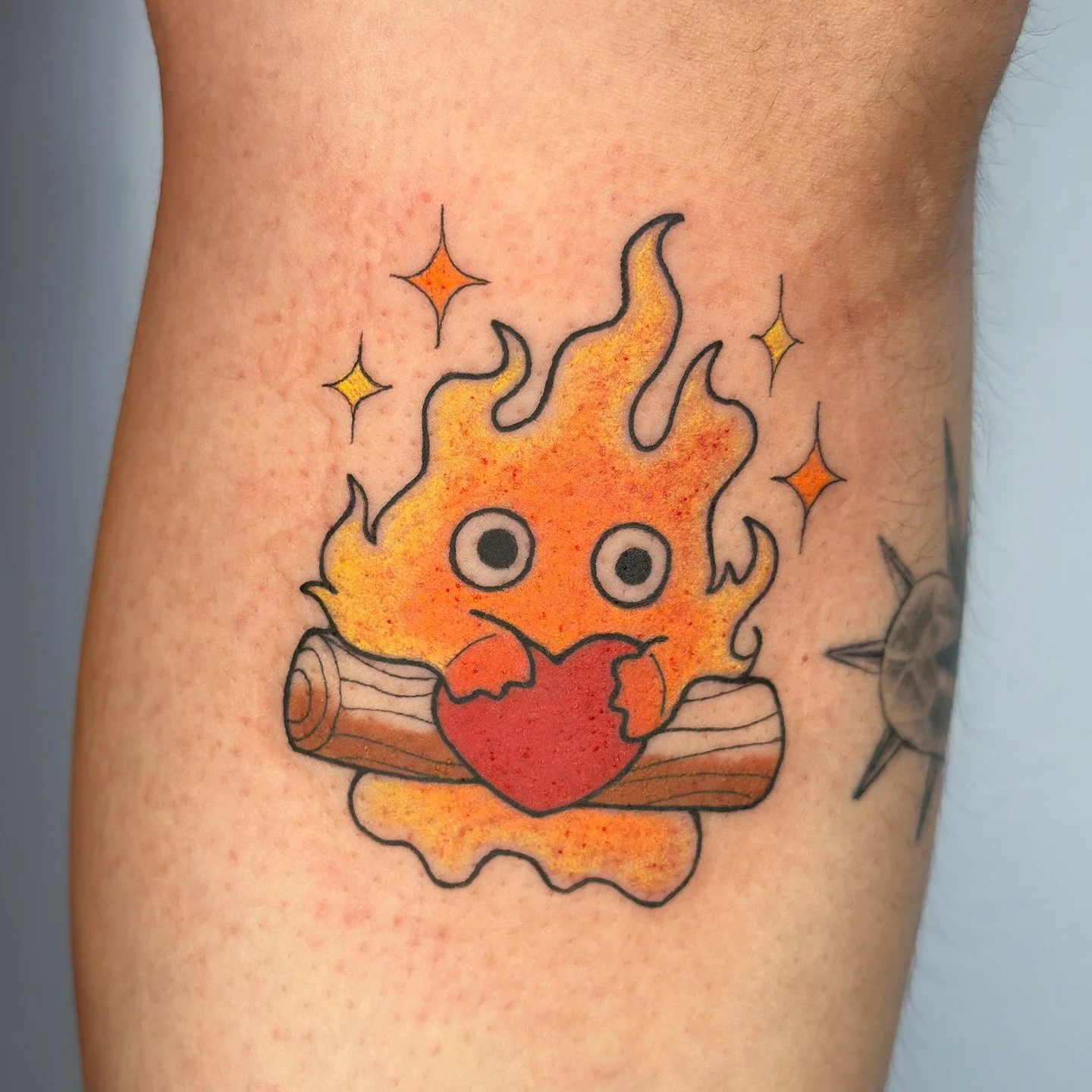 Calcifer ! ❤️ 🧡 
.
From my flash see more @bons.lagoon 
.
Booking April - July ! Tattoo booking form linked in bio 📍 Los Angeles/OC
.
#calcifer #ghiblitattoo #animetattoo color kawaii flash ghibli howls moving castle tattoo