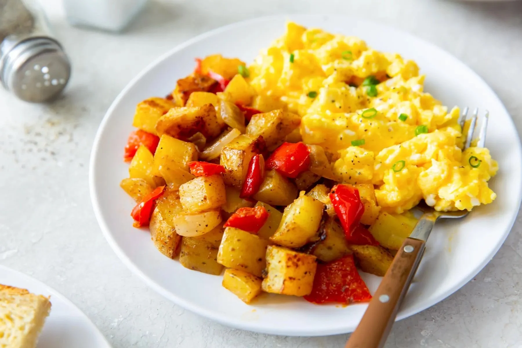 Scrambled Eggs with cheese and homestyle Potatoes dinner