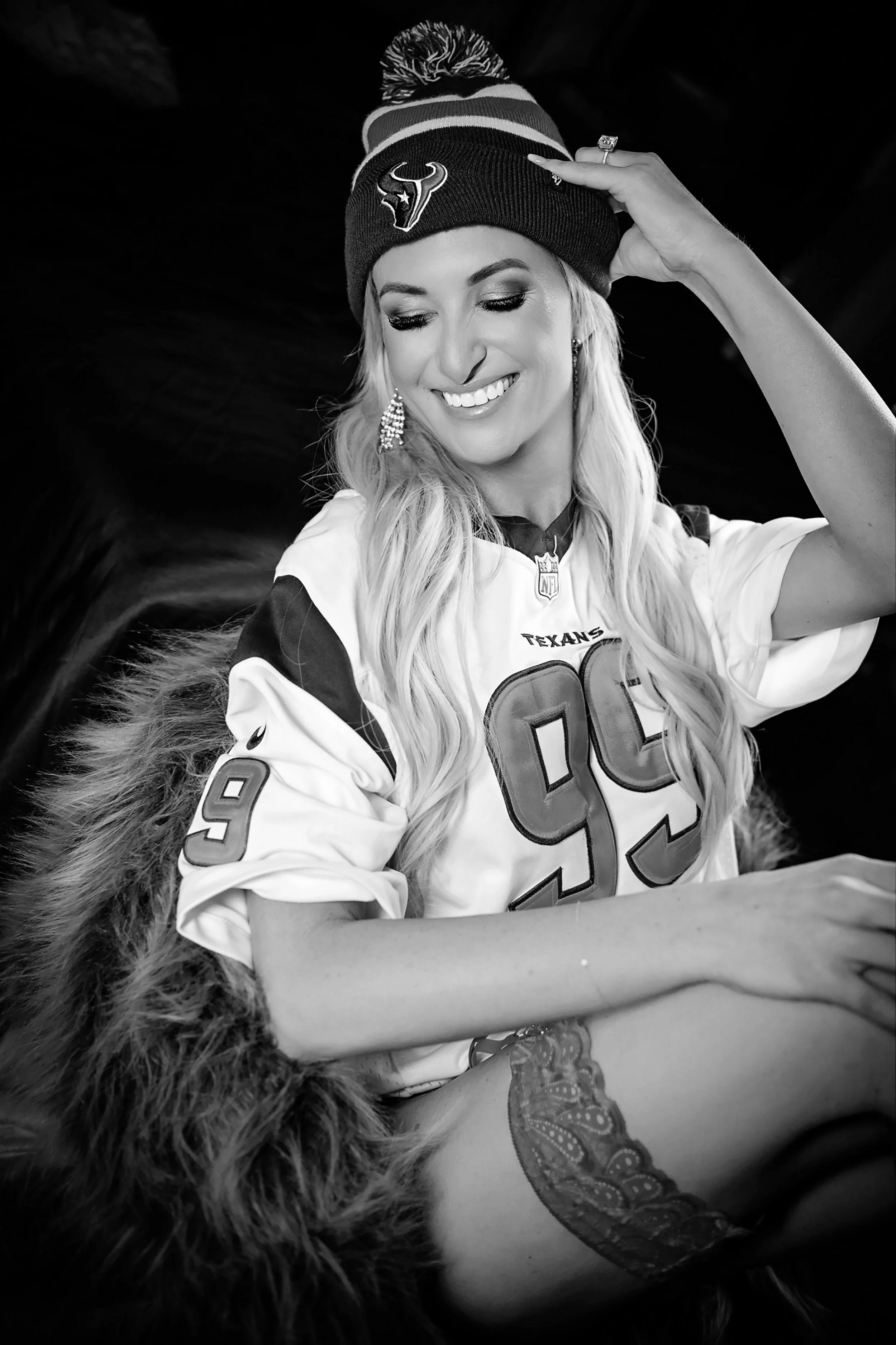 Boudoir portrait of a woman in elevated sportswear, photographed in a natural light studio in Round Rock near Austin, TX