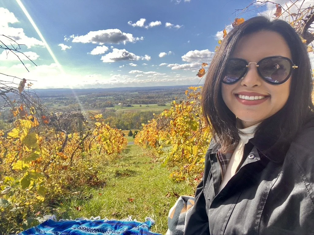 woman sitting in vineyard