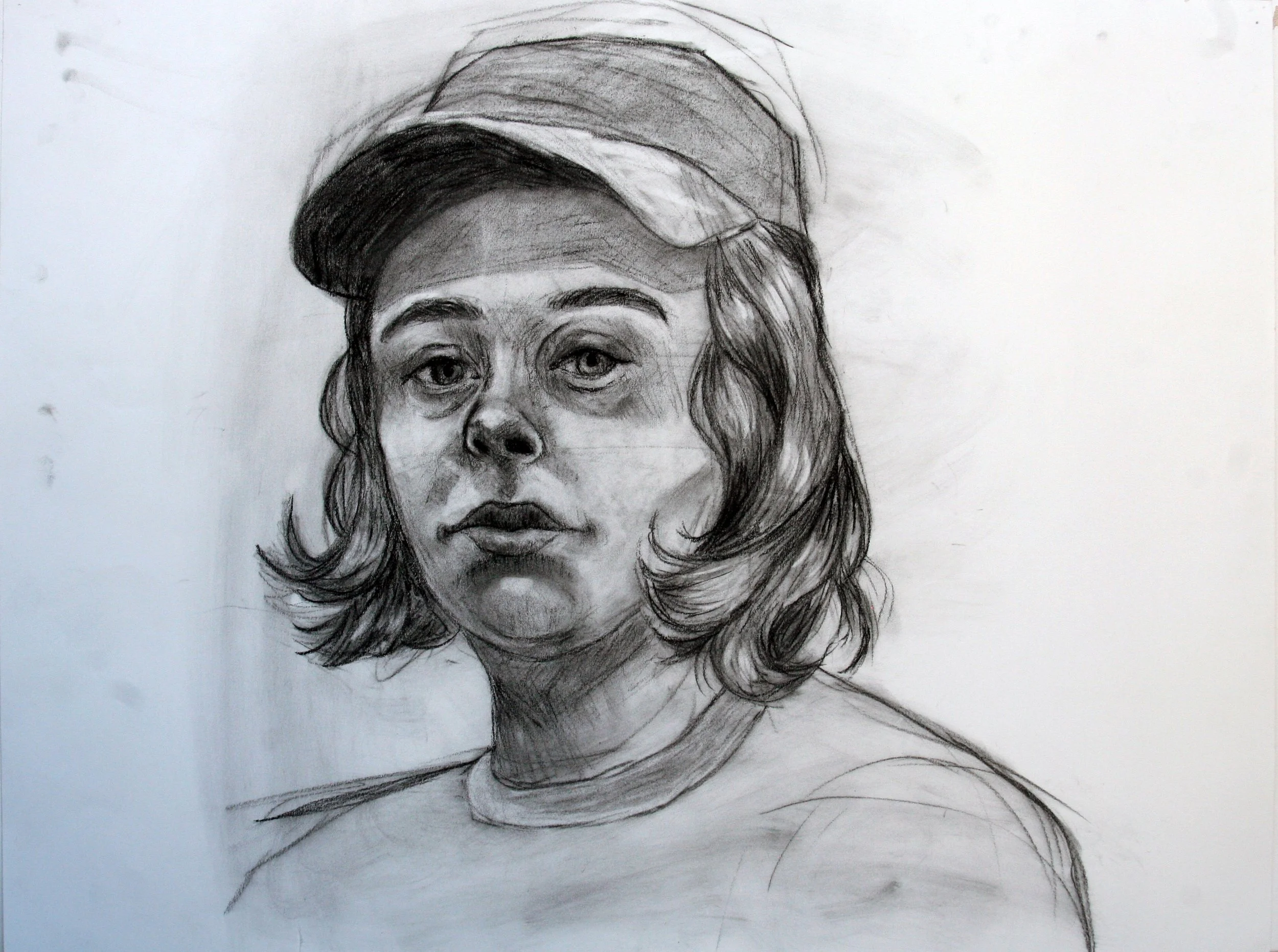 Self Portrait | Charcoal on paper. This piece was completed during my time at Howard Community College in my Drawing II class.