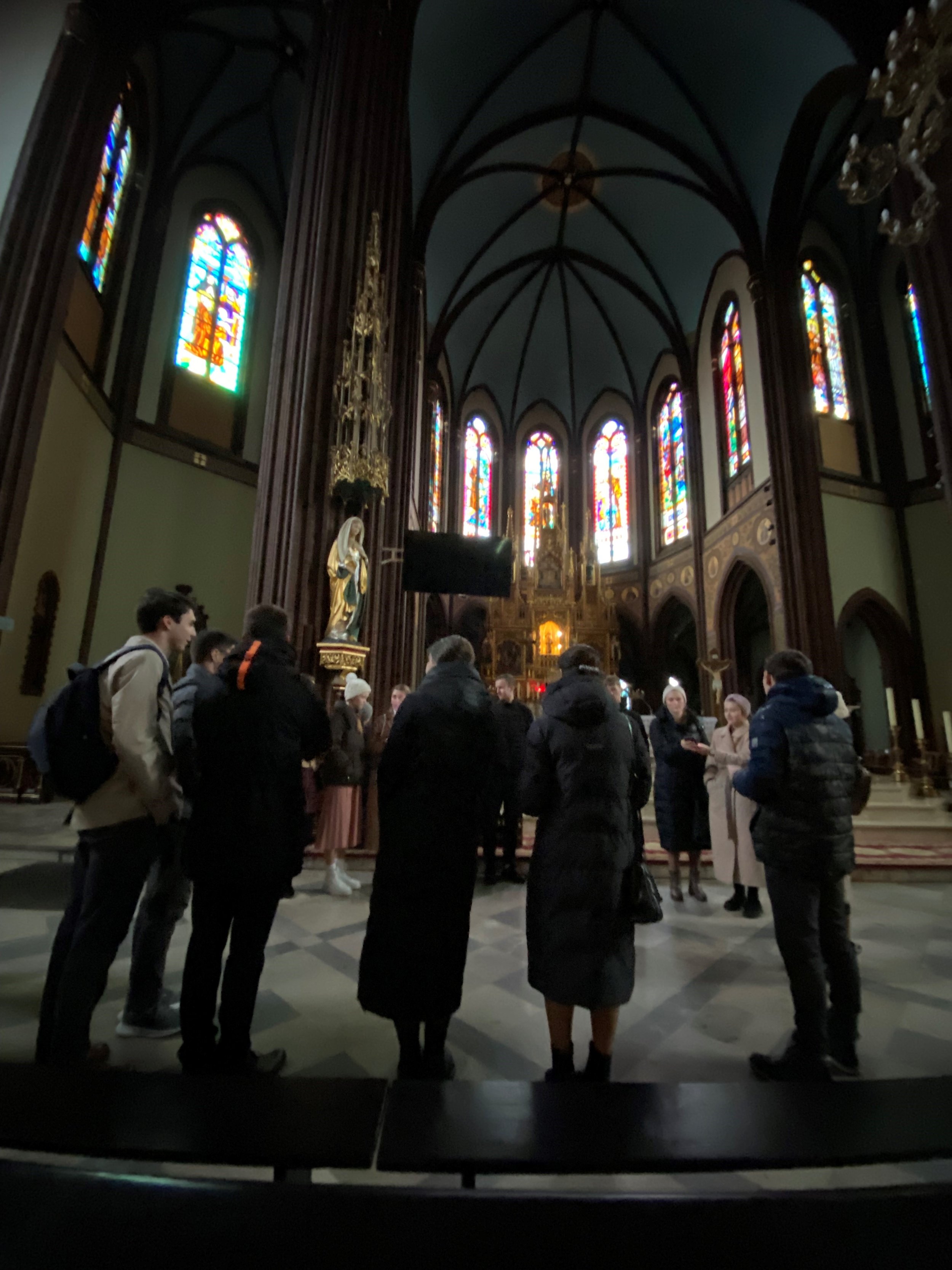 Refugees enjoy the acoustics in a Catholic cathedral as they sing Gospel songs