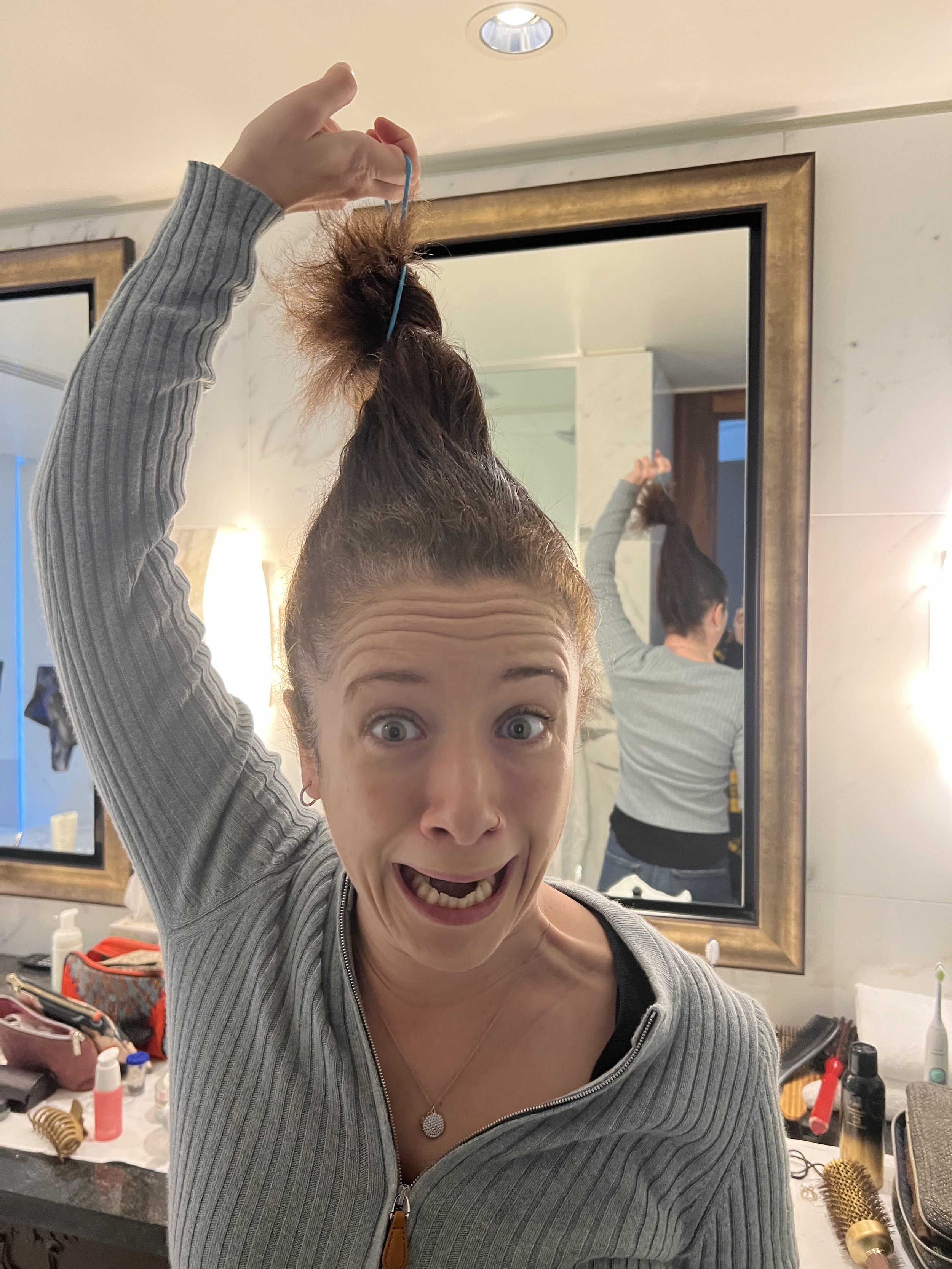 I just wanted you all to see how much time and effort it takes to create my wonderful Morning Hair for your pleasure. First, I use all of those hair products and tools you see on the counter behind me to make my hair beautiful. Then, I wad up all m