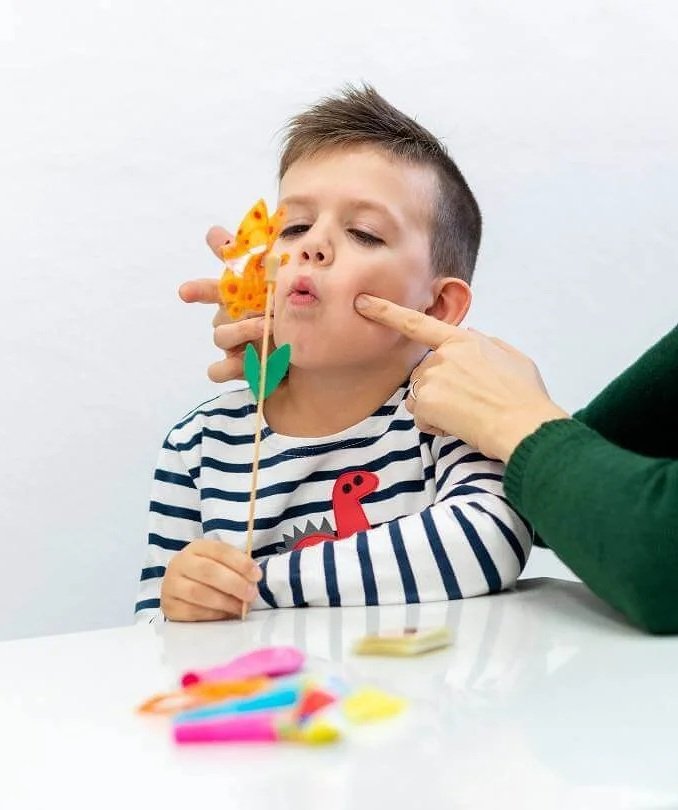 Speech therapist in Darien practicing articulation with a child.