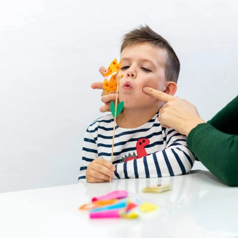 Speech therapist providing articulation therapy to a child in Fairfield County, Connecticut.
