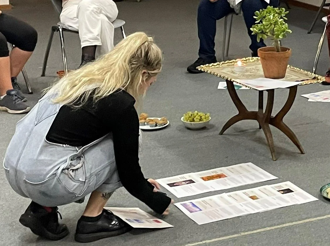 Young woman examining information about the Charter for Change at the Newcastel event