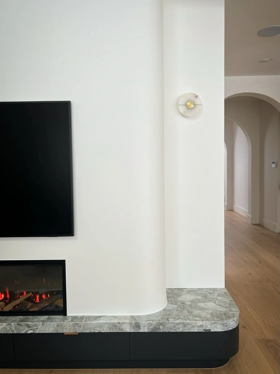 Soft curves and natural stone come together beautifully in this fireplace feature from our Altona North project ✨

A statement of subtle elegance, it adds warmth, texture, and a timeless touch to the living space.

Builder @saaoudconstructions
