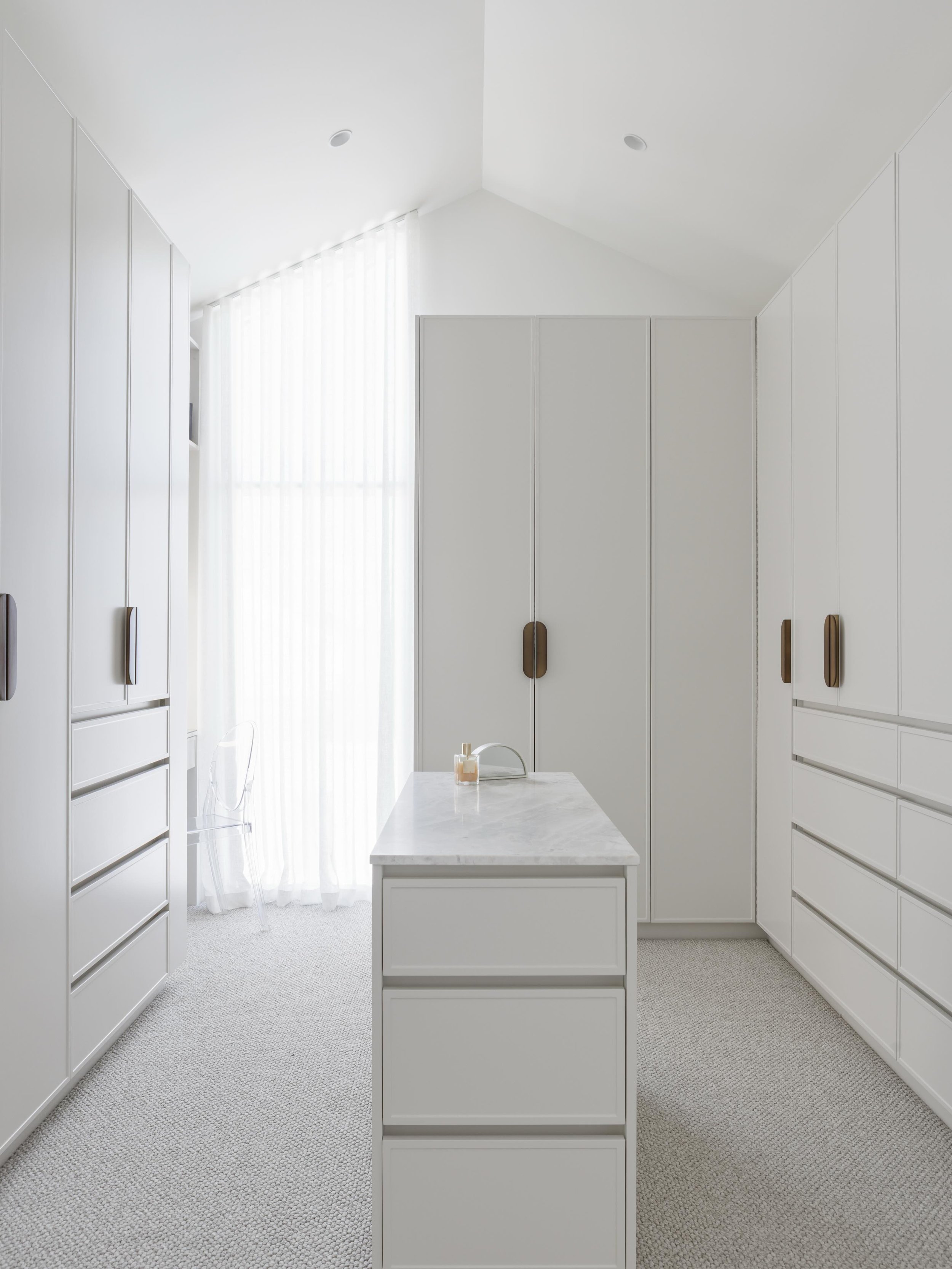 The best spaces aren&rsquo;t just beautiful, they work beautifully too.

This custom walk-in robe was designed to maximise storage while maintaining a soft, elegant aesthetic. 

From the marble-topped island to the integrated makeup station and sheer