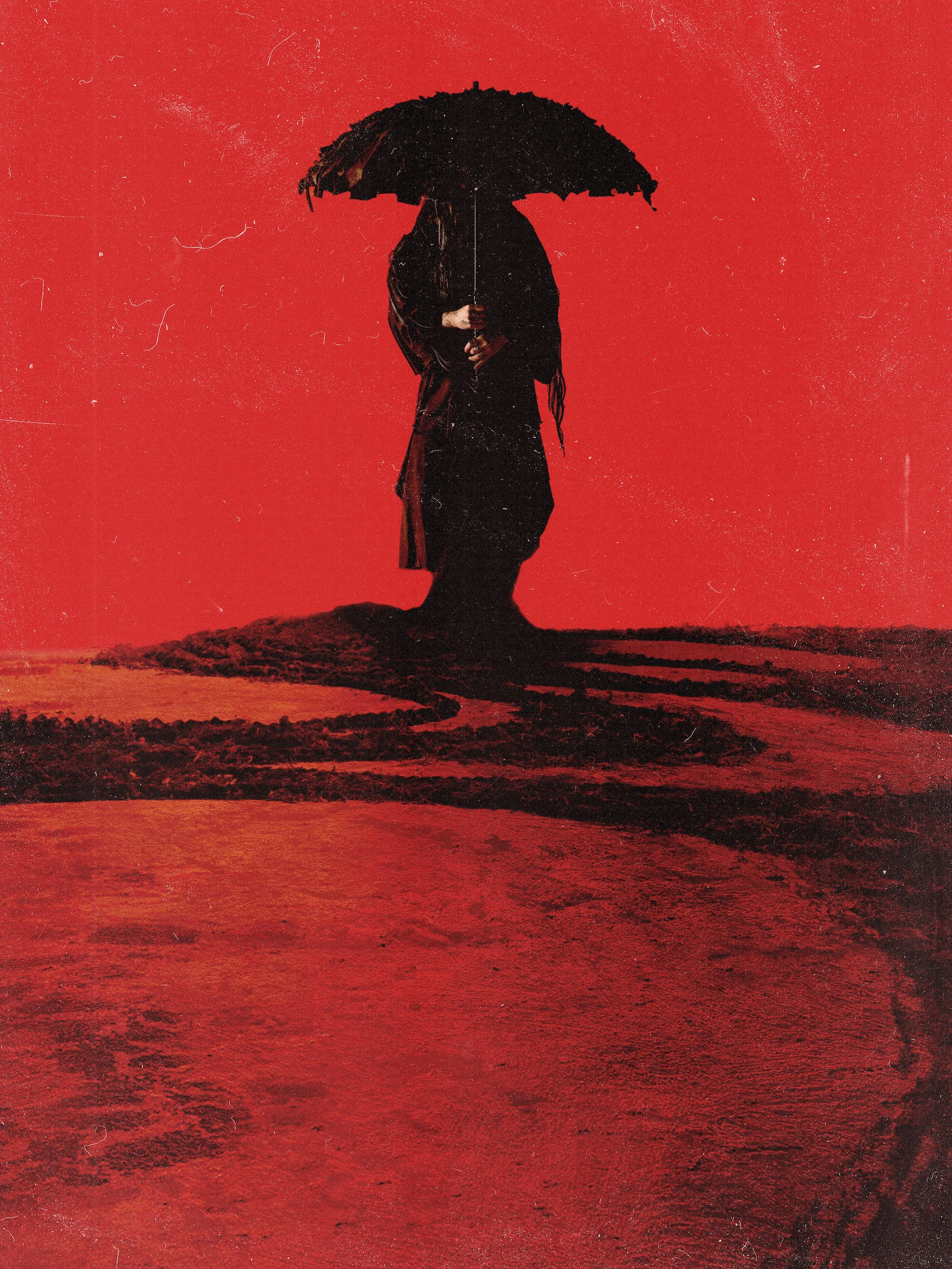 Silhouette of a person holding an umbrella on a small patch of land surrounded by water, with a red sky background.