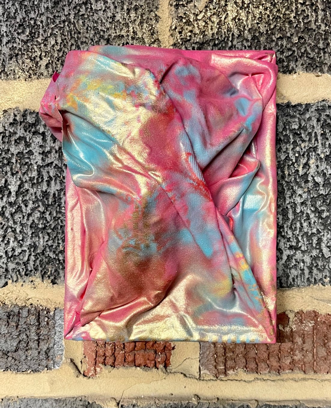 "Containment 110", 2022. Used bedsheets, resin, spray paint. $25.00
