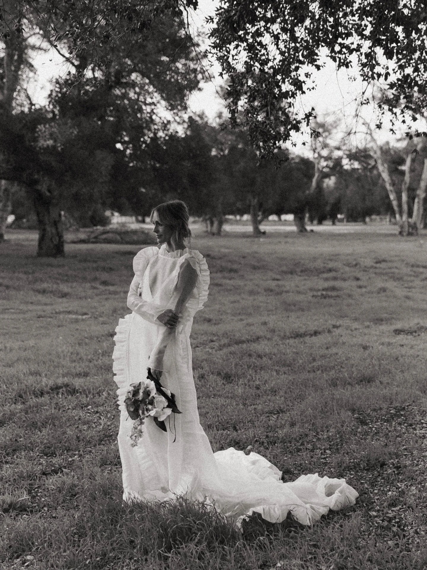 A favorite of Teddi, in the oak tree grove on her grandma&rsquo;s street.

A real life angel, this one.

Love you to the stars @teddi.prior 

🖤

Custom gown by @odylynetheceremony 
Florals by the talented @delightfulflowerco 

#losangelesweddingphot