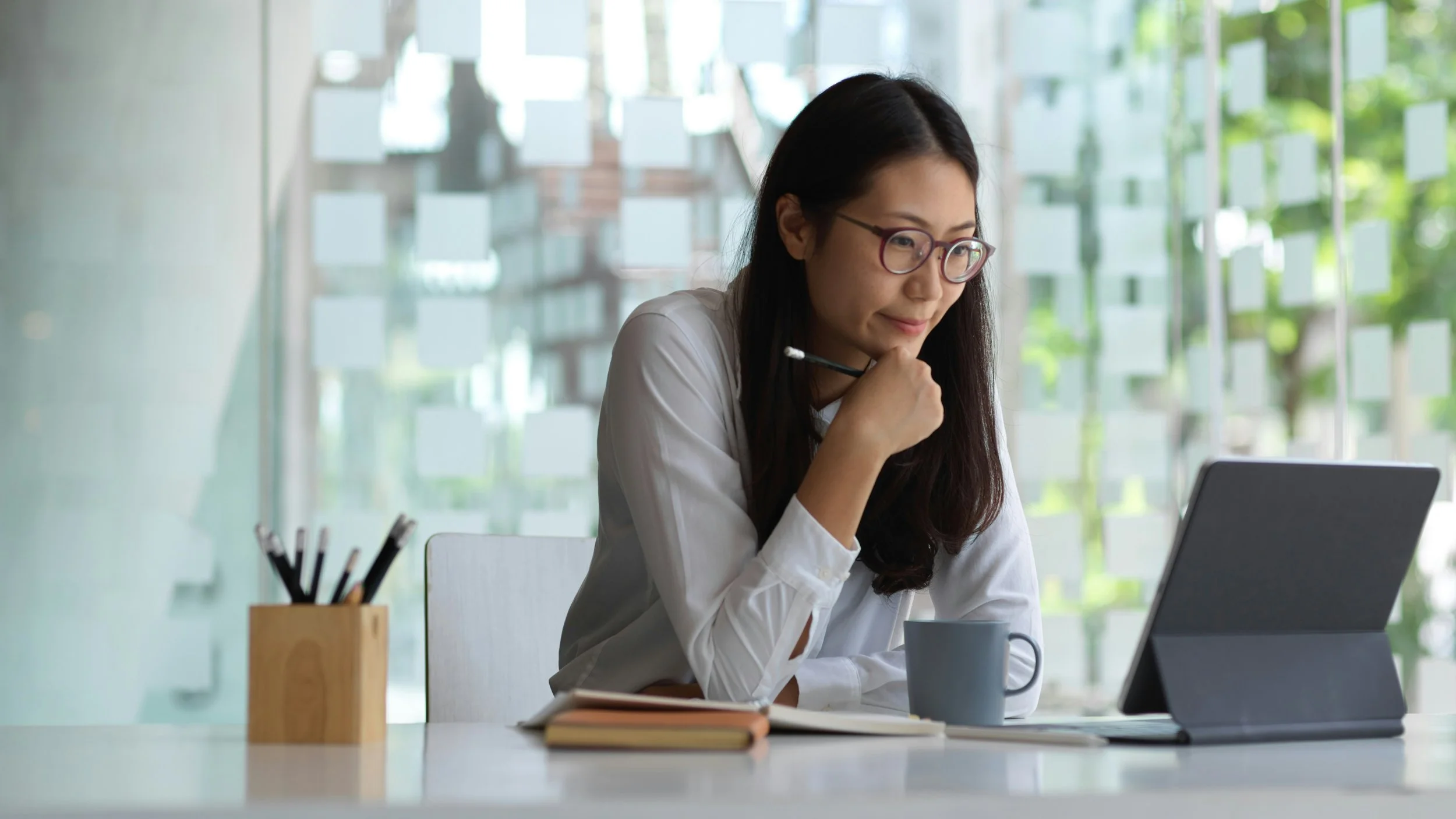 Woman reflecting at desk — how handling mistakes is the real personal growth work, not perfection