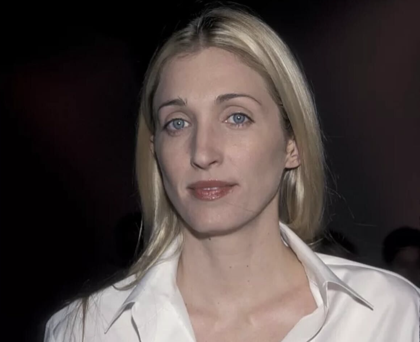 Woman standing confidently in meeting room - leadership coach on self leadership and authentic leadership for women