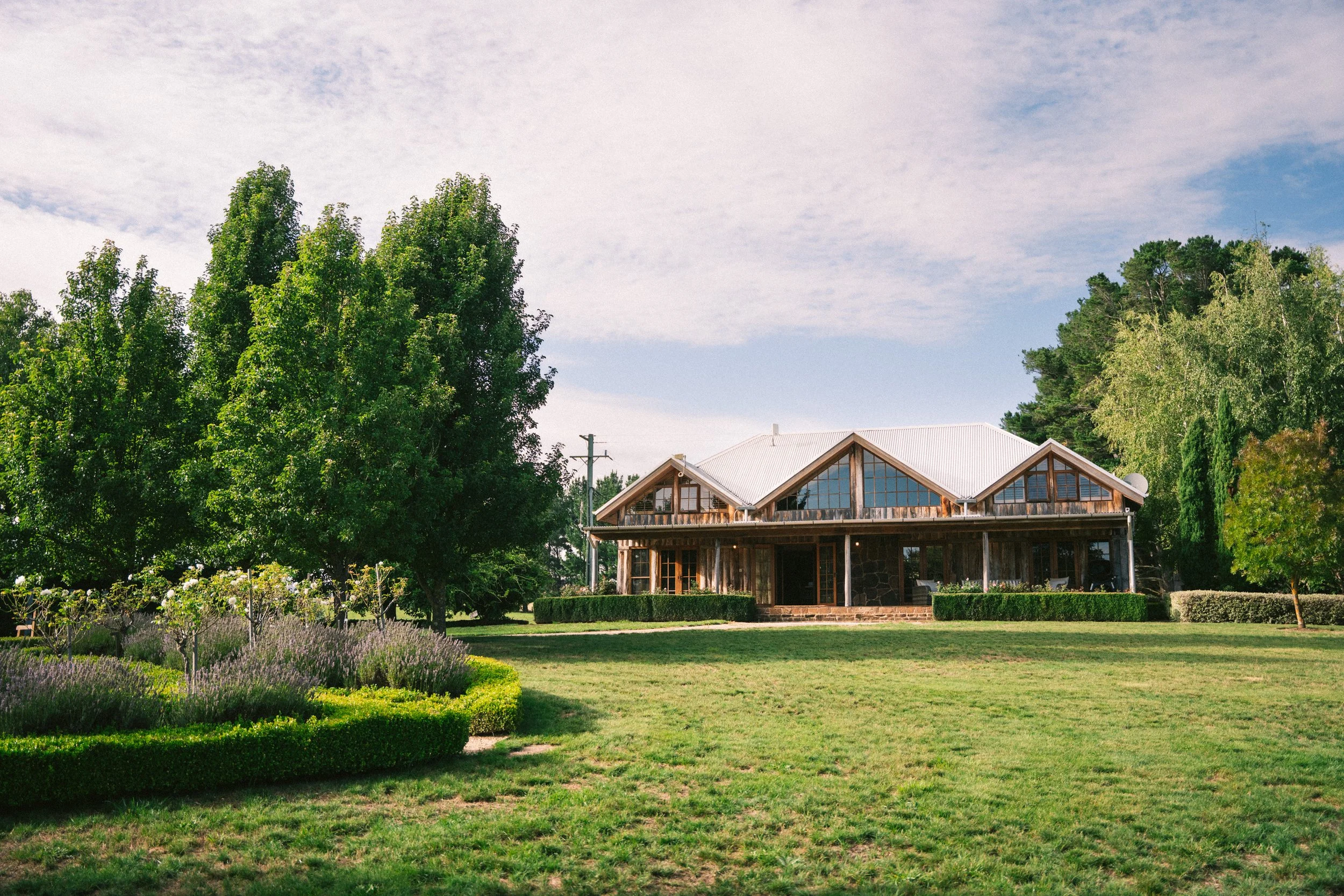 The Lodge exterior and manicured lawns at a luxury farm stay in NSW — Waldara Estate, Edith NSW, near Sydney and the Blue Mountains