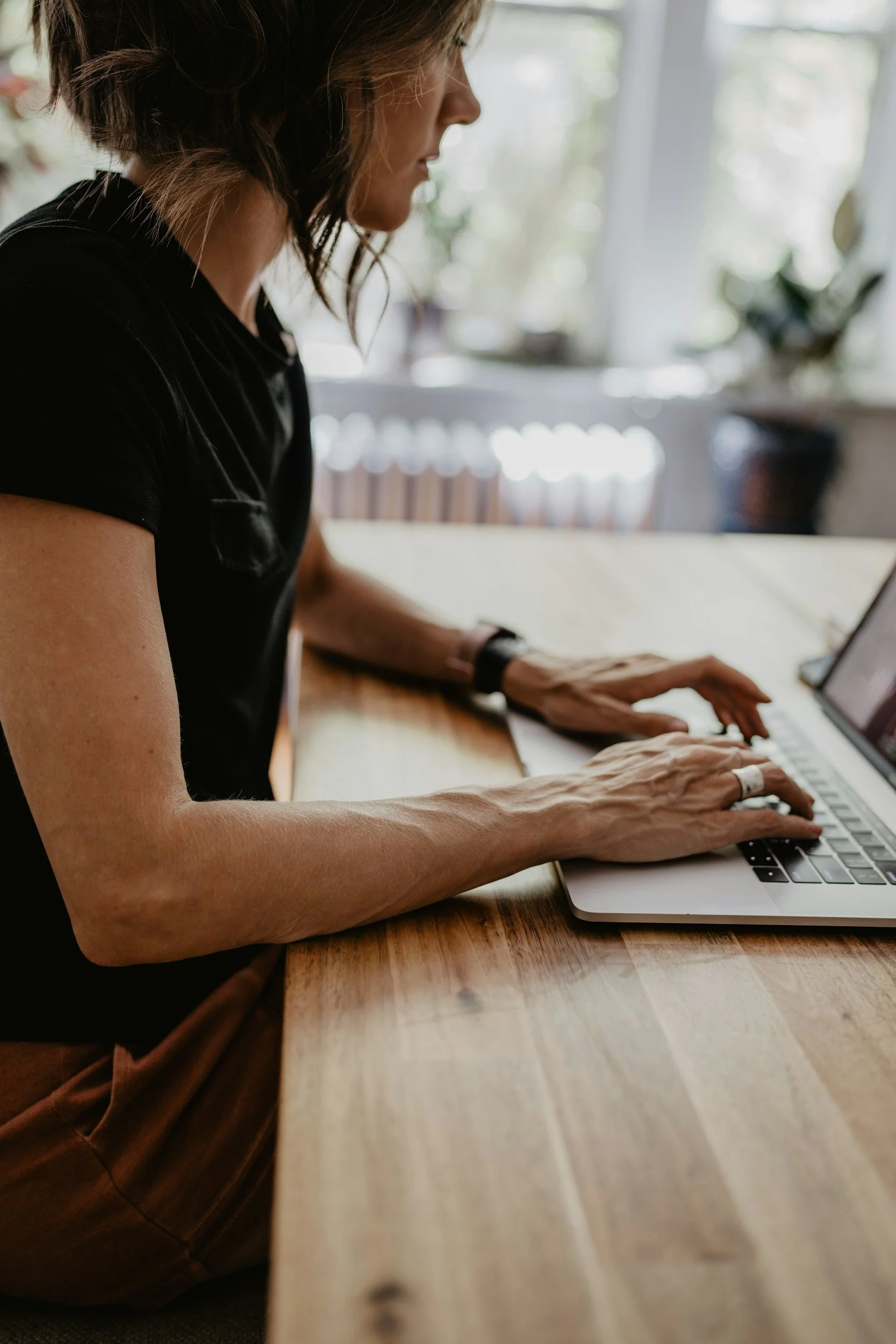 A mom researching ABA therapy options online while comparing providers for her child with autism