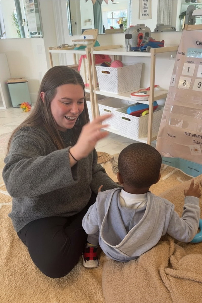 BCBA working with child during play-based ABA therapy session