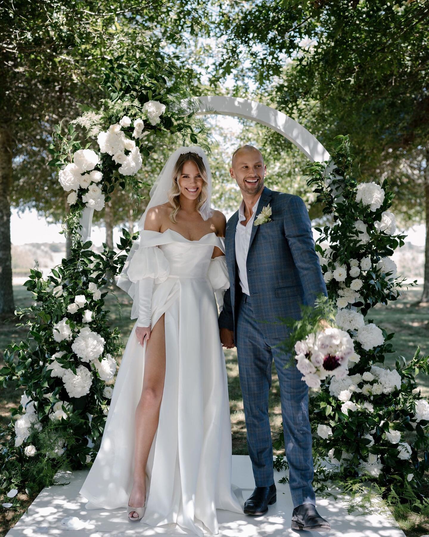 Dappled sunlight, lush ceremony florals + these two 🤍🤍 LOVE, love, love!

Photo | @haute.weddings 
Bridal gown | @heracouture 
Groom&rsquo;s suit | @tedbaker 
Hair + MU | @kimberly_hill_makeup_artist 
Florals | @libertyeventstyling 

#weddingceremo