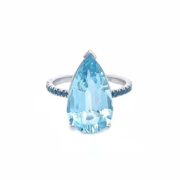 White gold ring with a large, teardrop-shaped aquamarine gemstone set in the center against a white background.