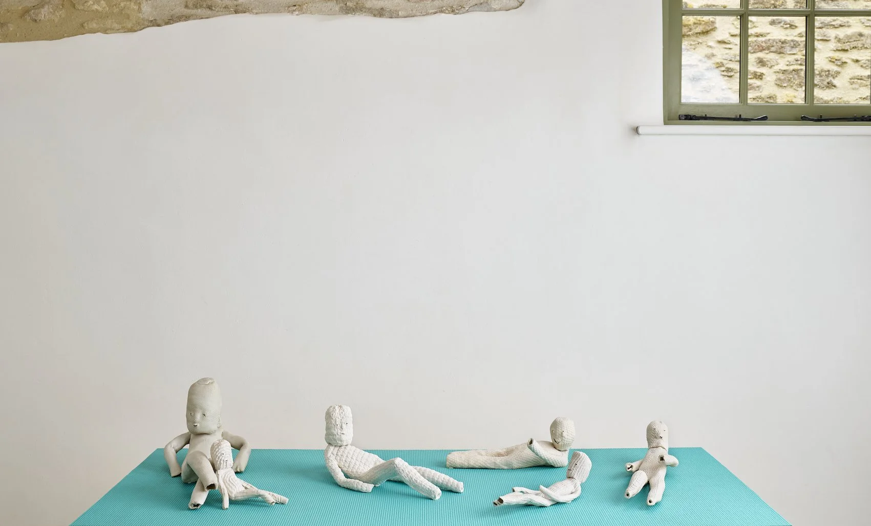 Reclining Figures, 2024. Glazed ceramic & porcelain. 160 x 65 x 28 cm. Re-imagines the sculptural tradition of the reclining figure. 