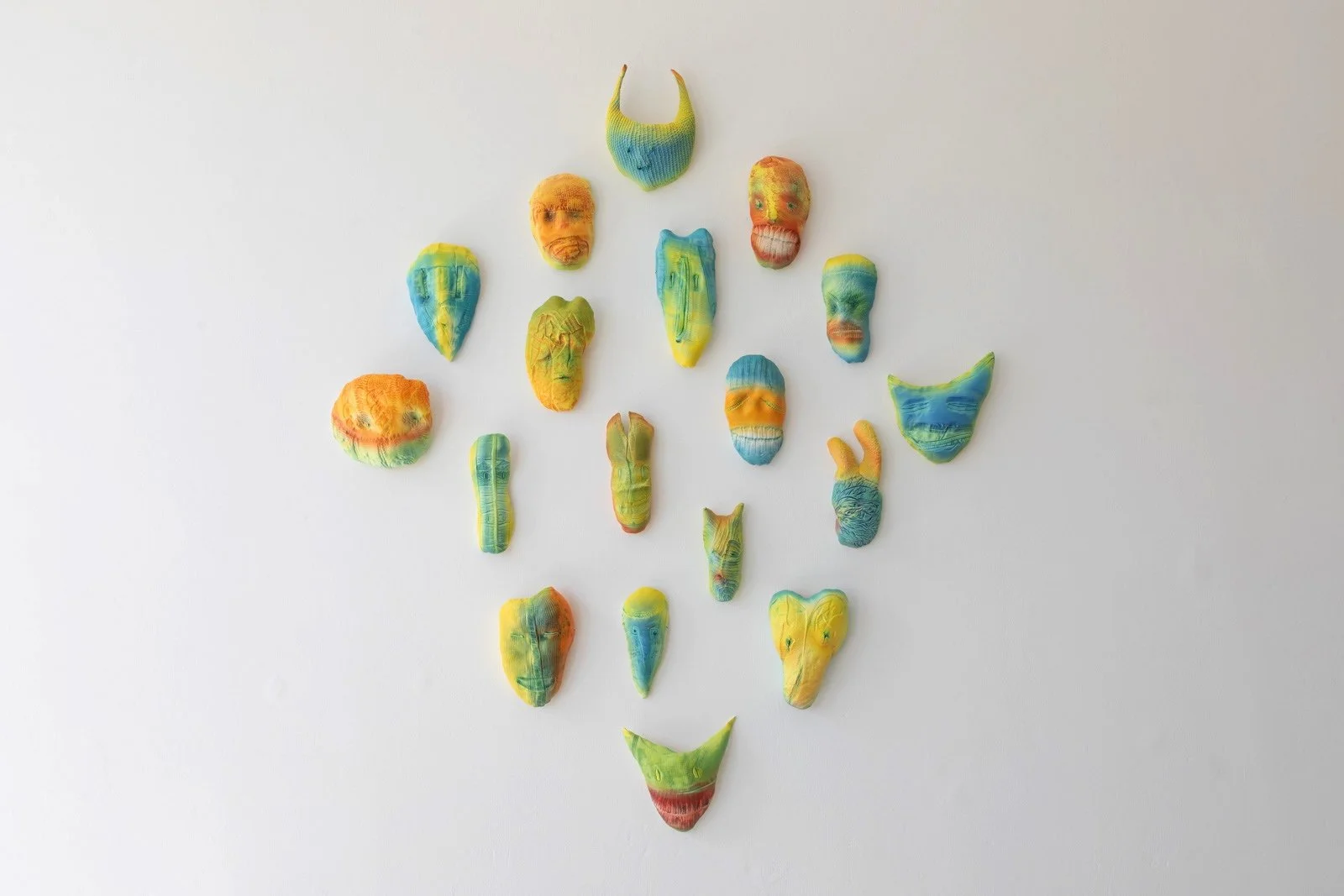 Spectral Constellation, 2024. Glazed ceramic. 125 x 95 x 6 cm. A family of ghostly, demon-like entities inspired by physical transformations in Greek mythology and animist ideas. Also evocative of Yōkai - personifications of supernatural and unaccoun