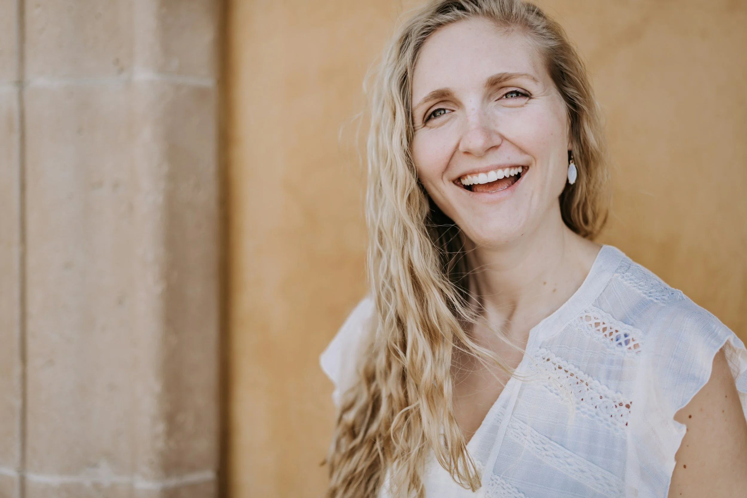 Photo of happy woman. Brainspotting Therapist in Indianapolis. Are you struggling with anxiety or depression? Discover how Brainspotting Therapy in Indianapolis can help.