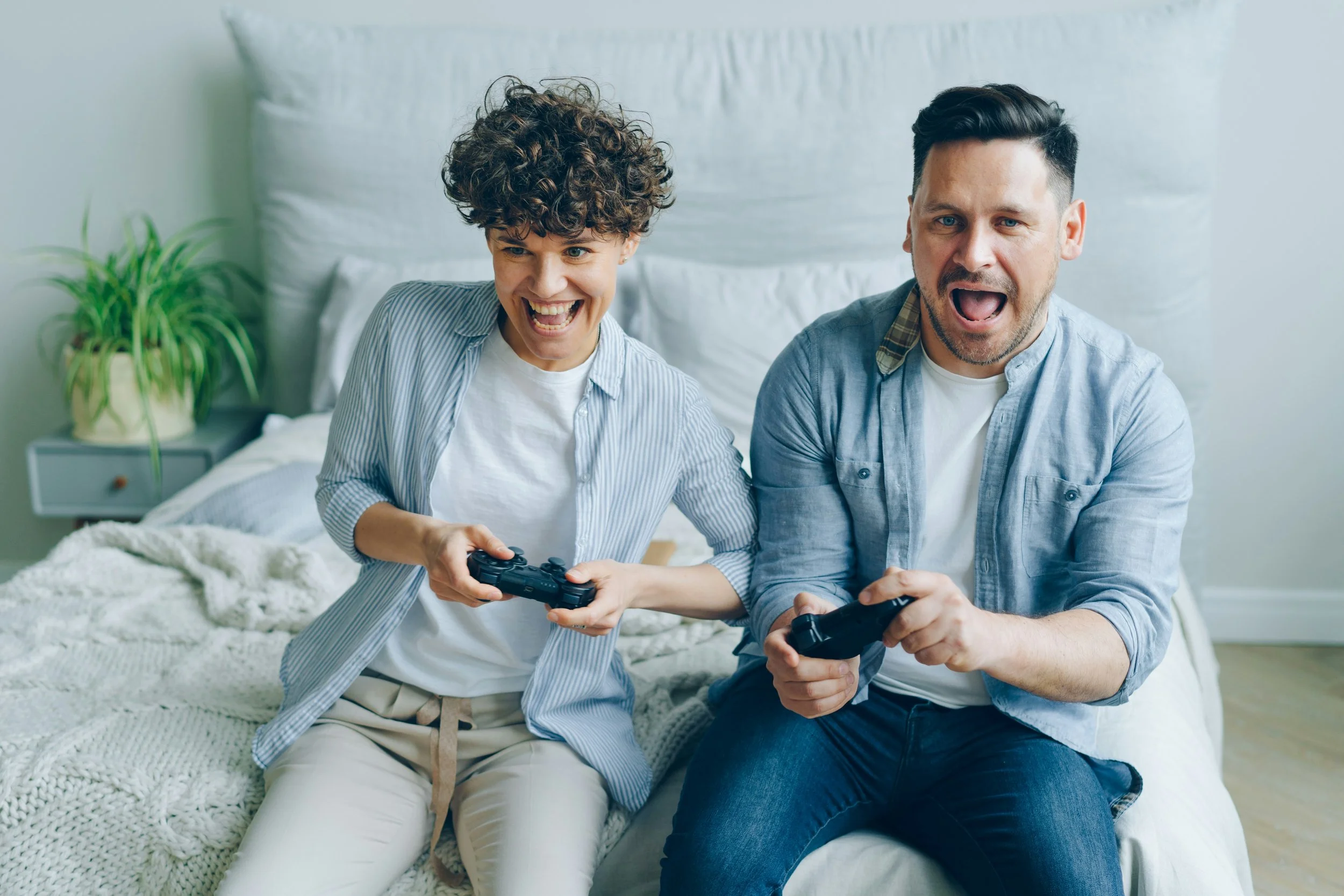 Photo of a father and son playing a video game. Has your child been bullied? Bullying can cause a whirlwind of emotions and negative thoughts for kids and teens. Therapy for teens in Indianapolis can help.